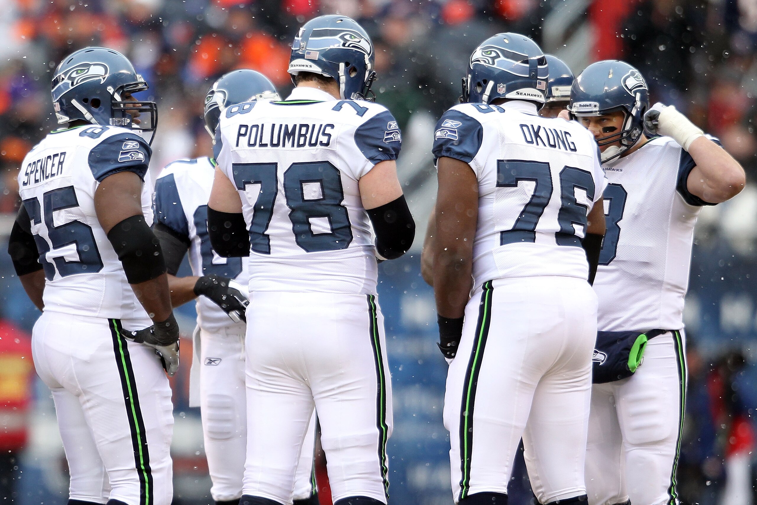 CHICAGO, IL - JANUARY 16: (R) Quarterback Matt Hasselbeck #8 of the Seattle Seahawks huddles with Russell Okung #76, Tyler Polumbus #78 and other members of the Seahawks offensive line against the Chicago Bears in the 2011 NFC divisional playoff game at CHICAGO, IL - JANUARY 16: (R) Quarterback Matt Hasselbeck #8 of the Seattle Seahawks huddles with Russell Okung #76, Tyler Polumbus #78 and other members of the Seahawks offensive line against the Chicago Bears in the 2011 NFC divisional playoff game at