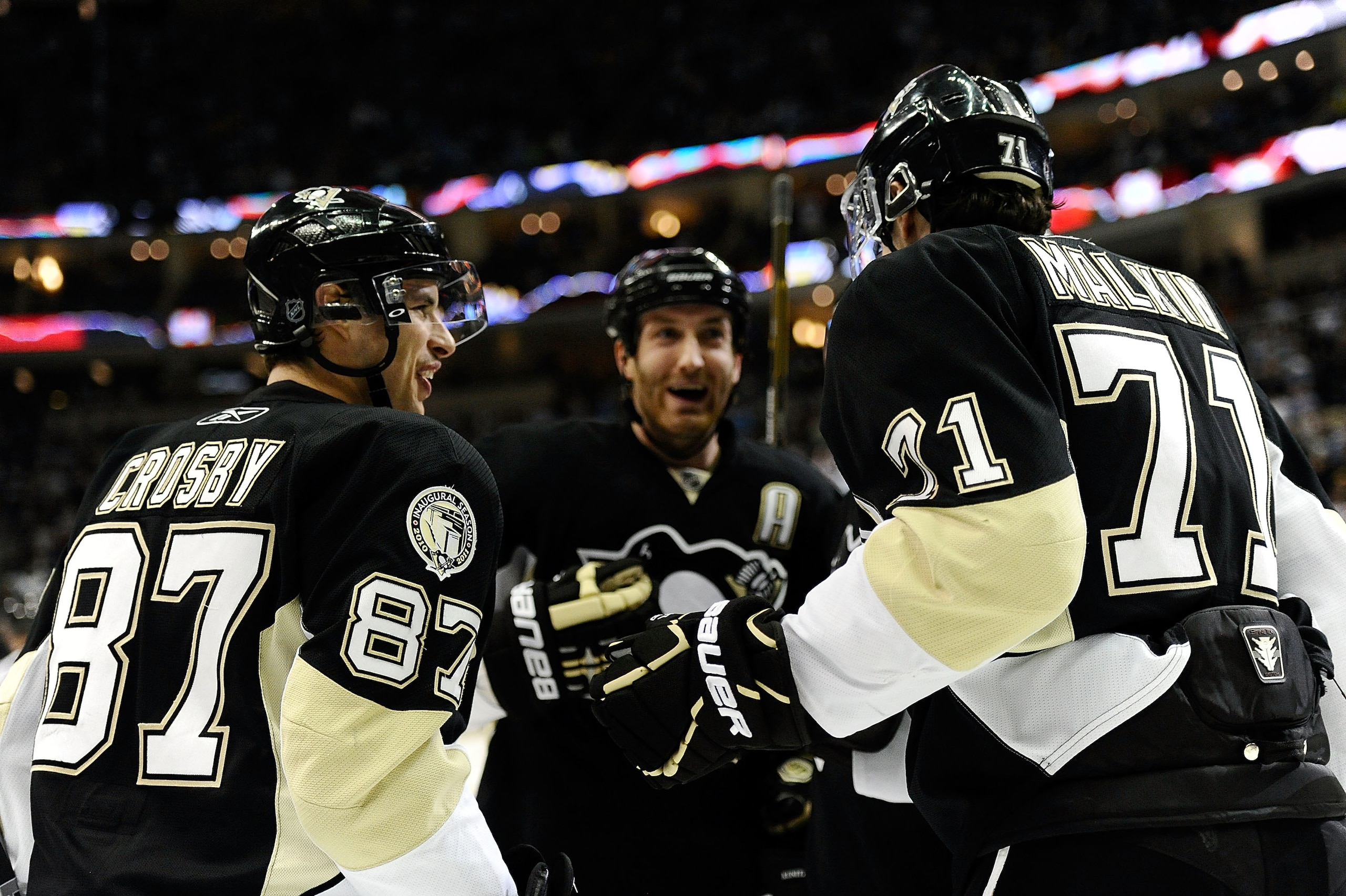 PITTSBURGH - DECEMBER 20: Sidney Crosby #87 and Evgeni Malkin #71 of the Pittsburgh Penguins celebrate a goal during their game against the Phoenix Coyotes on December 20, 2010 at the Consol Energy Center in Pittsburgh, Pennsylvania.  (Photo by Karl Walte