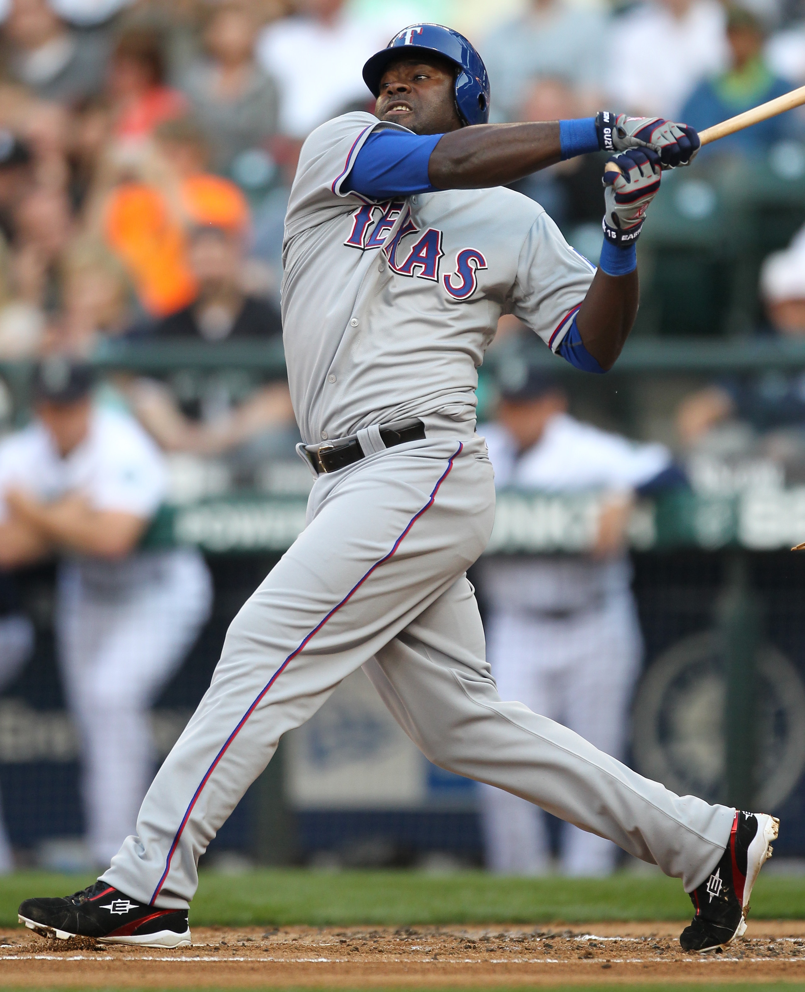 SEATTLE - AUGUST 03:  Cristian Guzman #12 of the Texas Rangers bats against the Seattle Mariners at Safeco Field on August 3, 2010 in Seattle, Washington. (Photo by Otto Greule Jr/Getty Images)