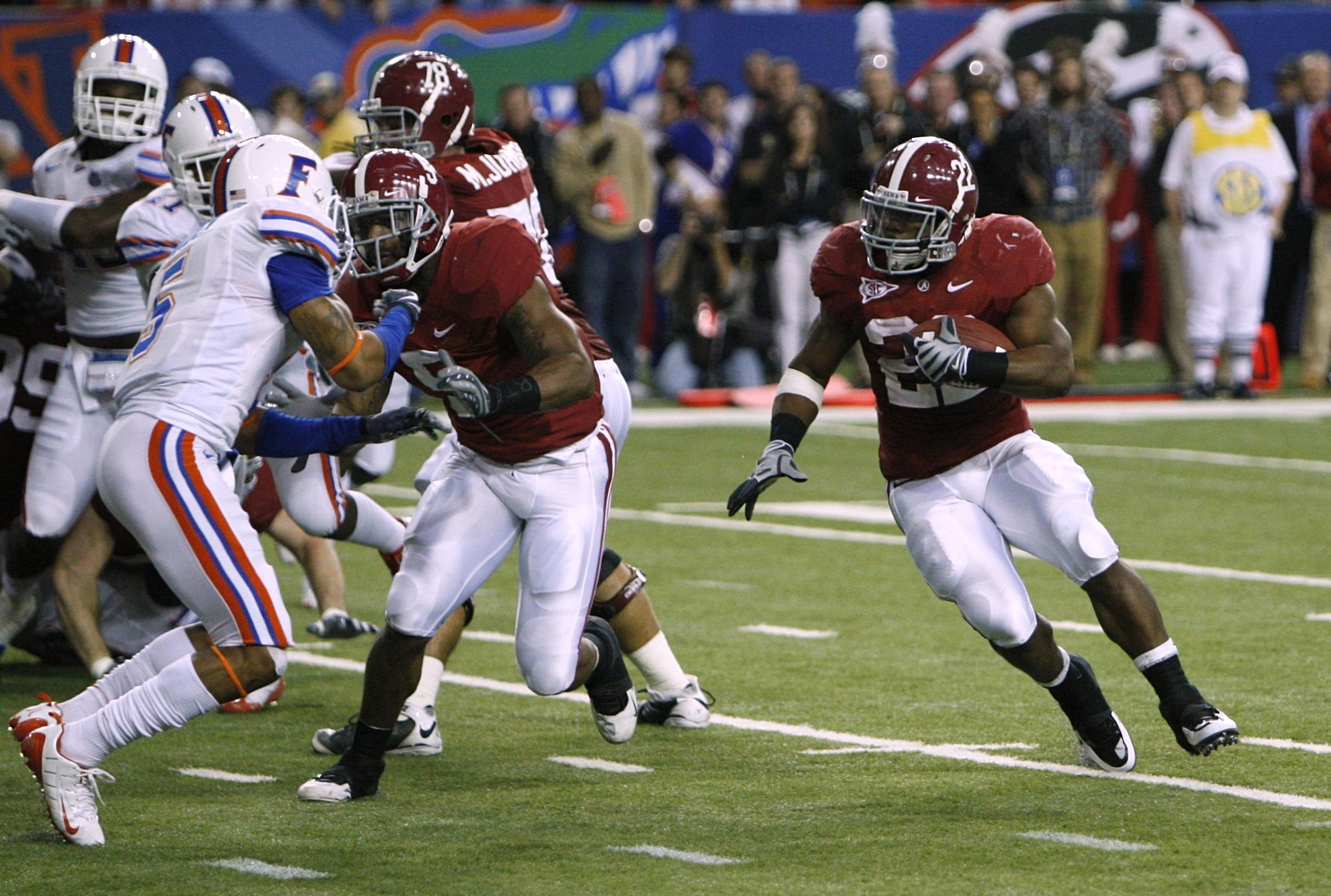 ATLANTA - DECEMBER 5:  Mark Ingram #22 of the Alabama Crimson Tide runs for a 3-yard rushing touchdown in the second quarter against the Florida Gators during the SEC Championship game at Georgia Dome on December 5, 2009 in Atlanta, Georgia.  (Photo by Ch