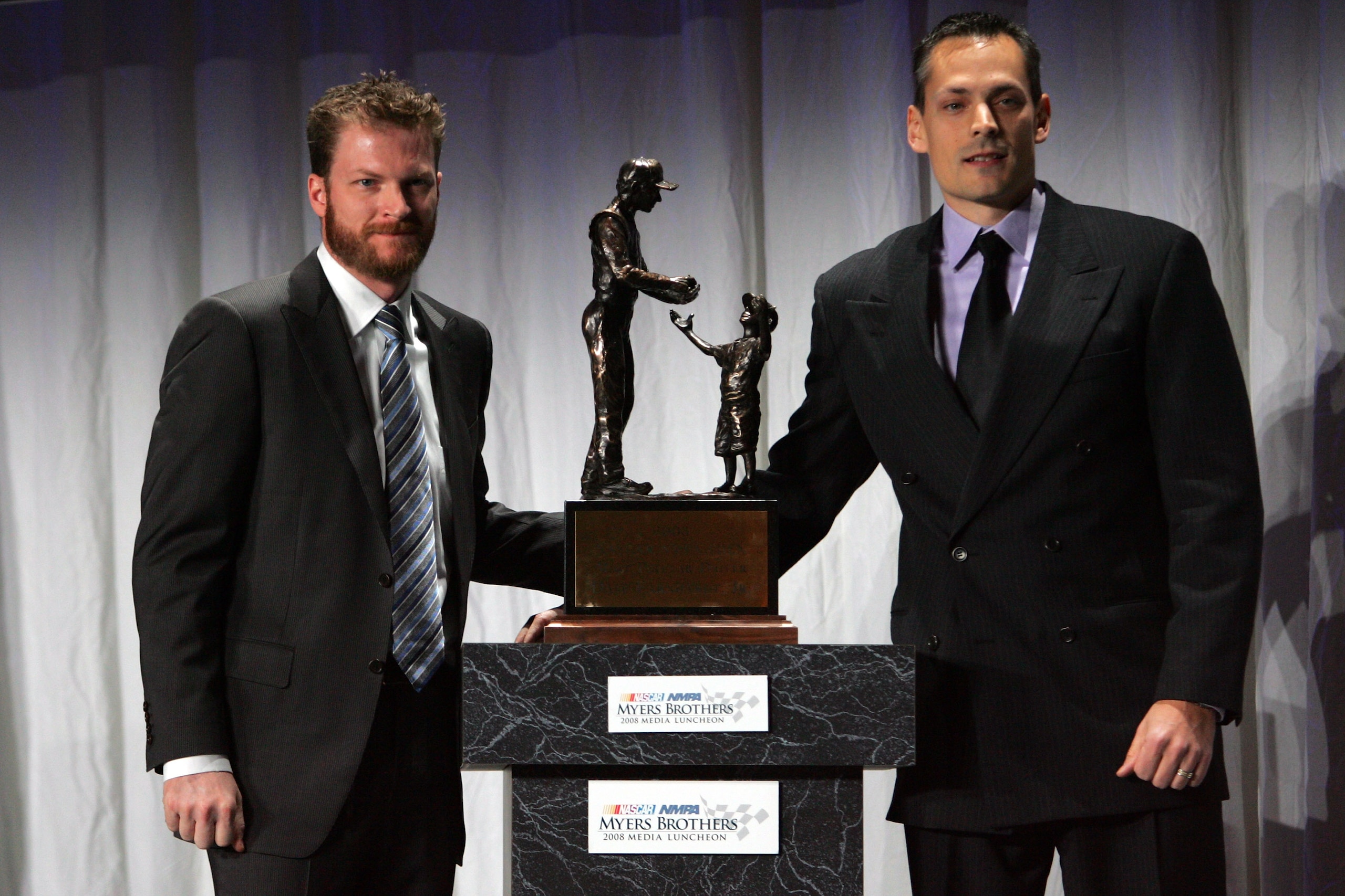 NEW YORK - DECEMBER 04: Dale Earnhardt Jr. (L) is presented with the Chex Cereal Most Popular Driver Award during NASCAR Champions Week NMPA Myers Brothers Media Luncheon at Cipriani on December 4, 2008 in New York City.  (Photo by Chris Trotman/Getty Ima