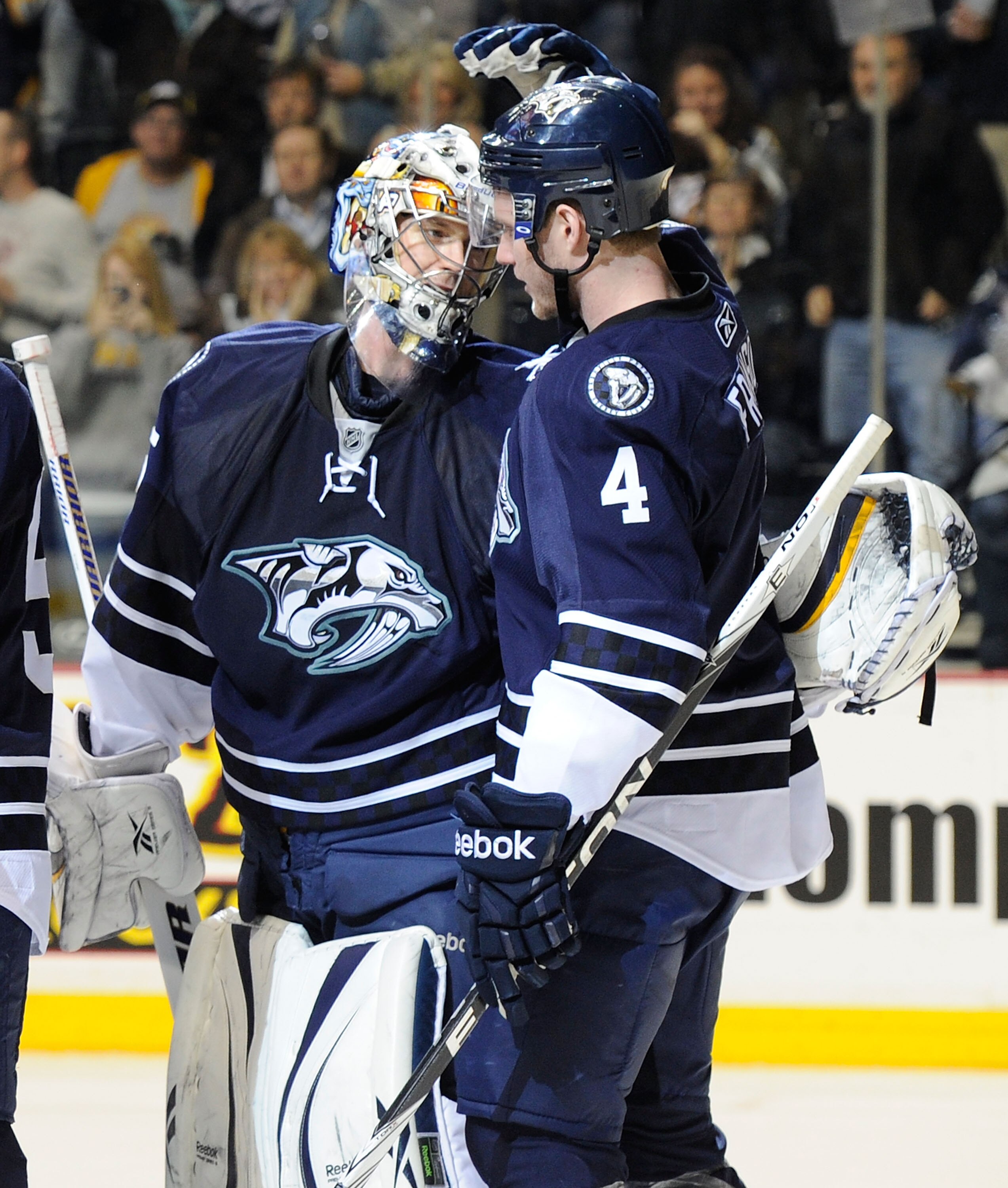 NASHVILLE, TN - FEBRUARY 12:   Cody Franson #4 of the Nashville Predators congratulates his goalie Pekka Rinne #35 after defeating the Colorado Avalancheon February 12, 2011 at the Bridgestone Arena in Nashville, Tennessee.  (Photo by Frederick Breedon/Ge