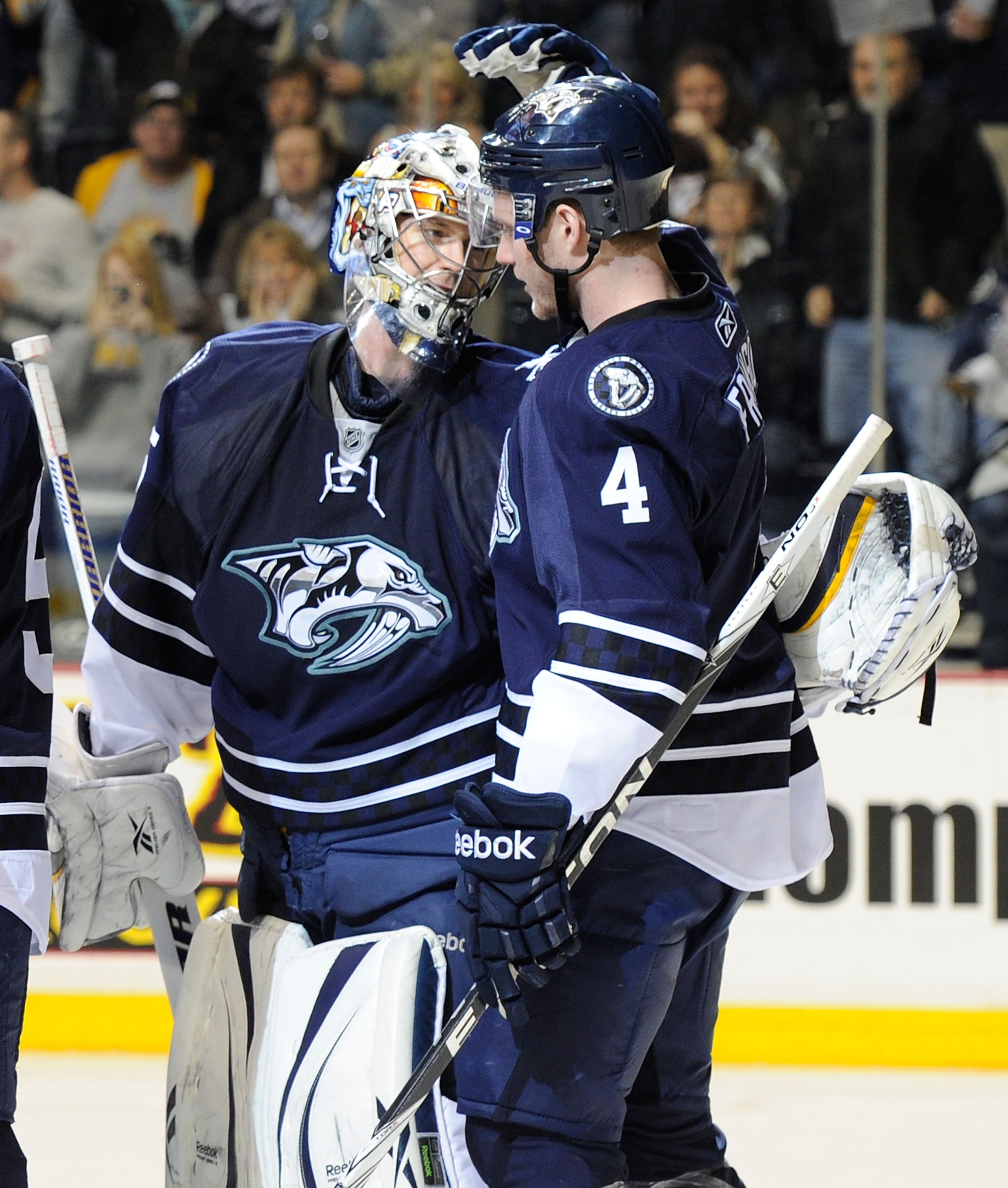 NASHVILLE, TN - FEBRUARY 12:   Cody Franson #4 of the Nashville Predators congratulates his goalie Pekka Rinne #35 after defeating the Colorado Avalancheon February 12, 2011 at the Bridgestone Arena in Nashville, Tennessee.  (Photo by Frederick Breedon/Ge