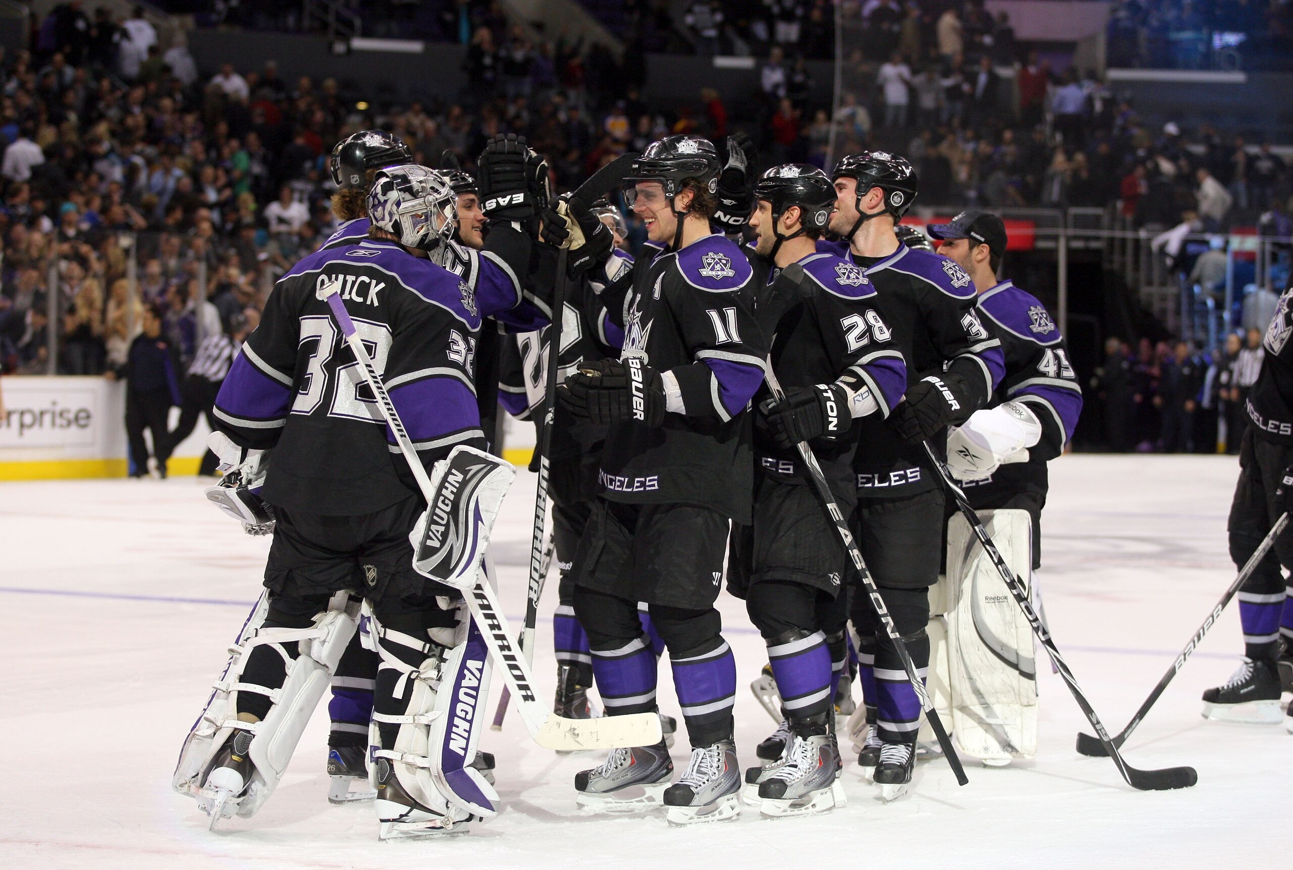 LOS ANGELES, CA - JANUARY 26:  Jonathan Quick #32 of the Los Angeles Kings celebrates with teammate Anze Kopitar #11 after defeating the San Jose Sharks 3-2 in shootout overtime at Staples Center on January 26, 2011 in Los Angeles, California.  (Photo by