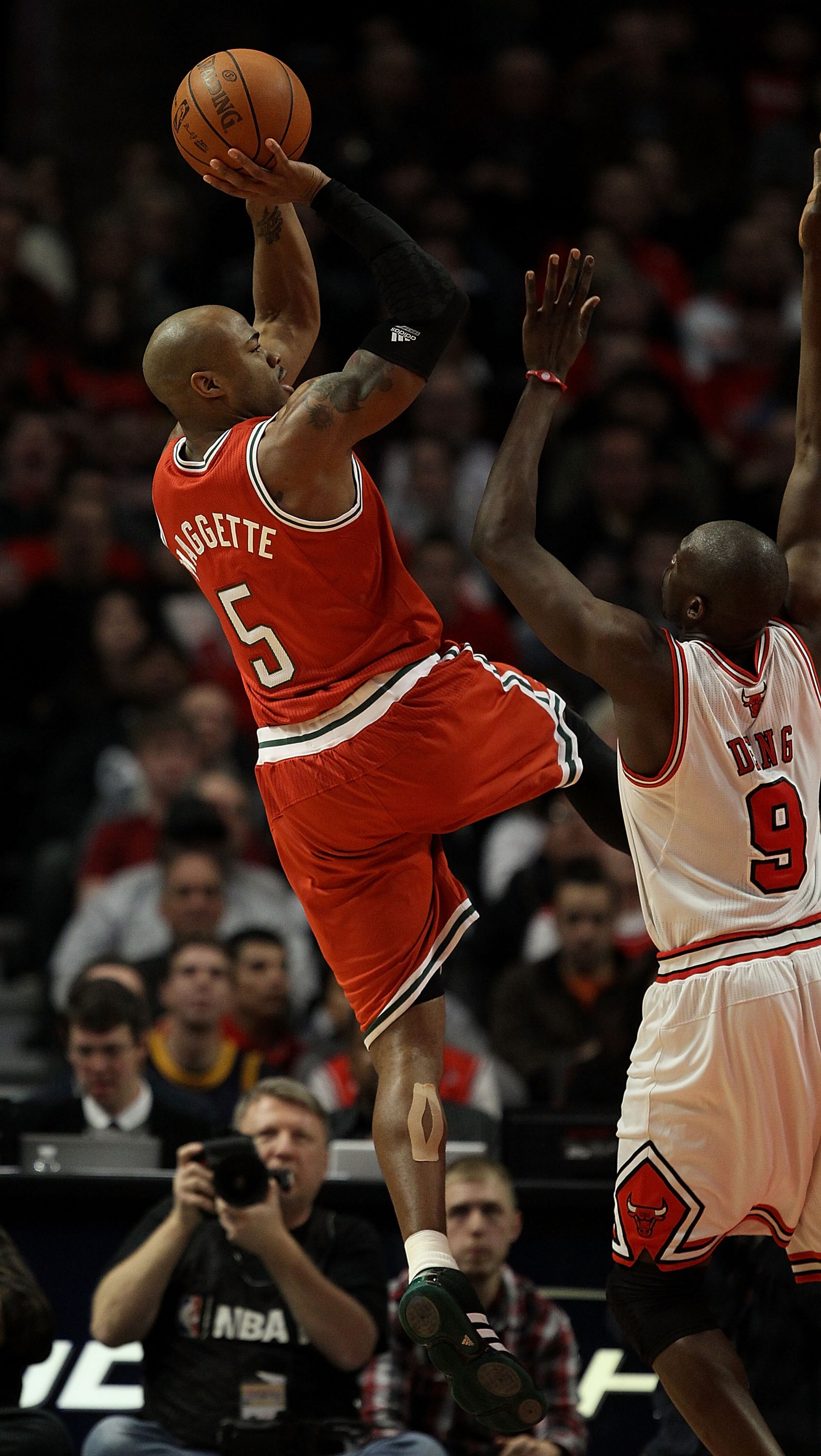 CHICAGO, IL - DECEMBER 28: Corey Maggette #5 of the Milwaukee Bucks puts up a shot over Loul Deng #9 of the Chicago Bulls at the United Center on December 28, 2010 in Chicago, Illinois. NOTE TO USER: User expressly acknowledges and agrees that, by downloa