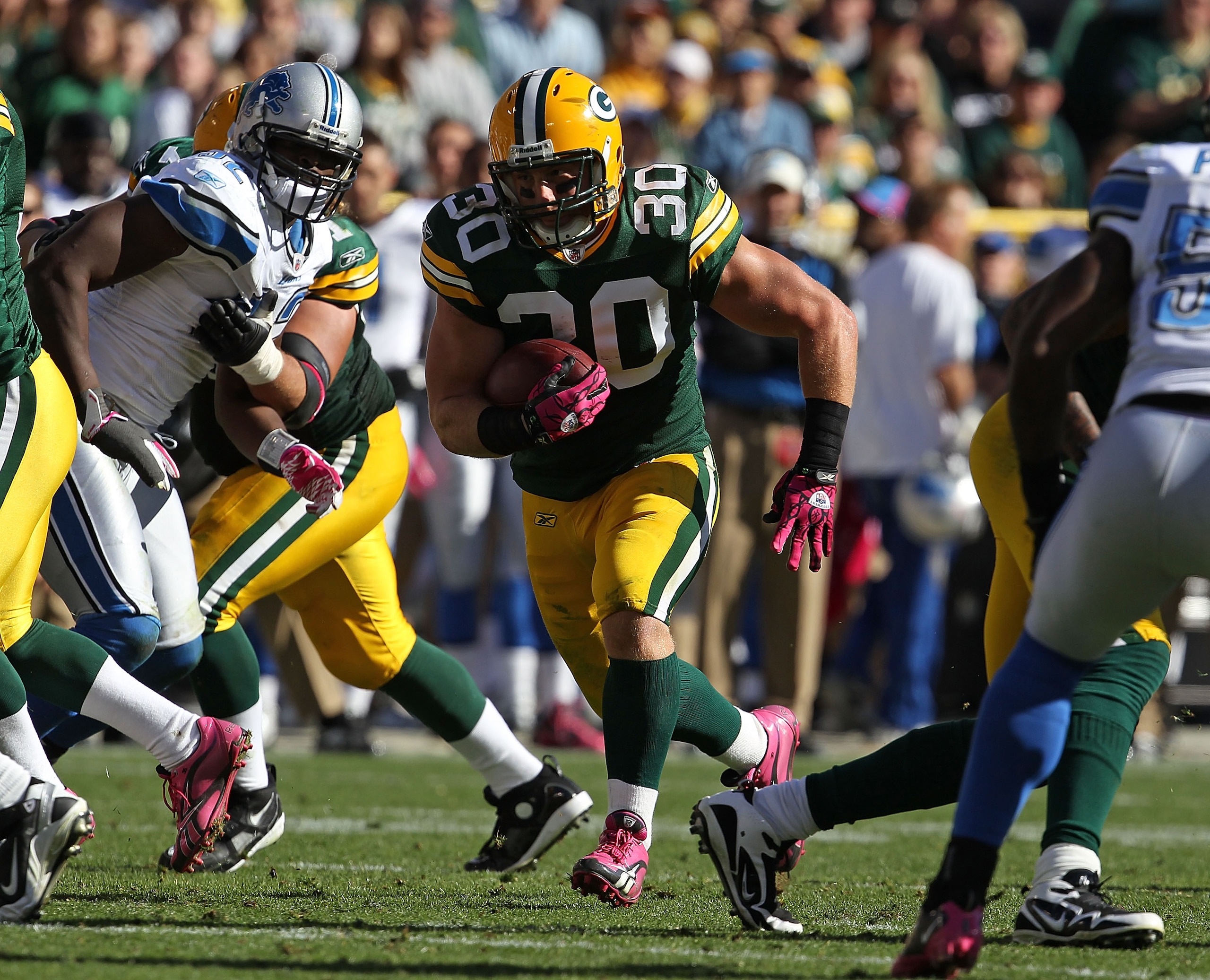 GREEN BAY, WI - OCTOBER 03: John Kuhn #30 of the Green Bay Packers runs against the Detroit Lions at Lambeau Field on October 3, 2010 in Green Bay, Wisconsin. The Packers defeated the Lions 28-26.  (Photo by Jonathan Daniel/Getty Images)