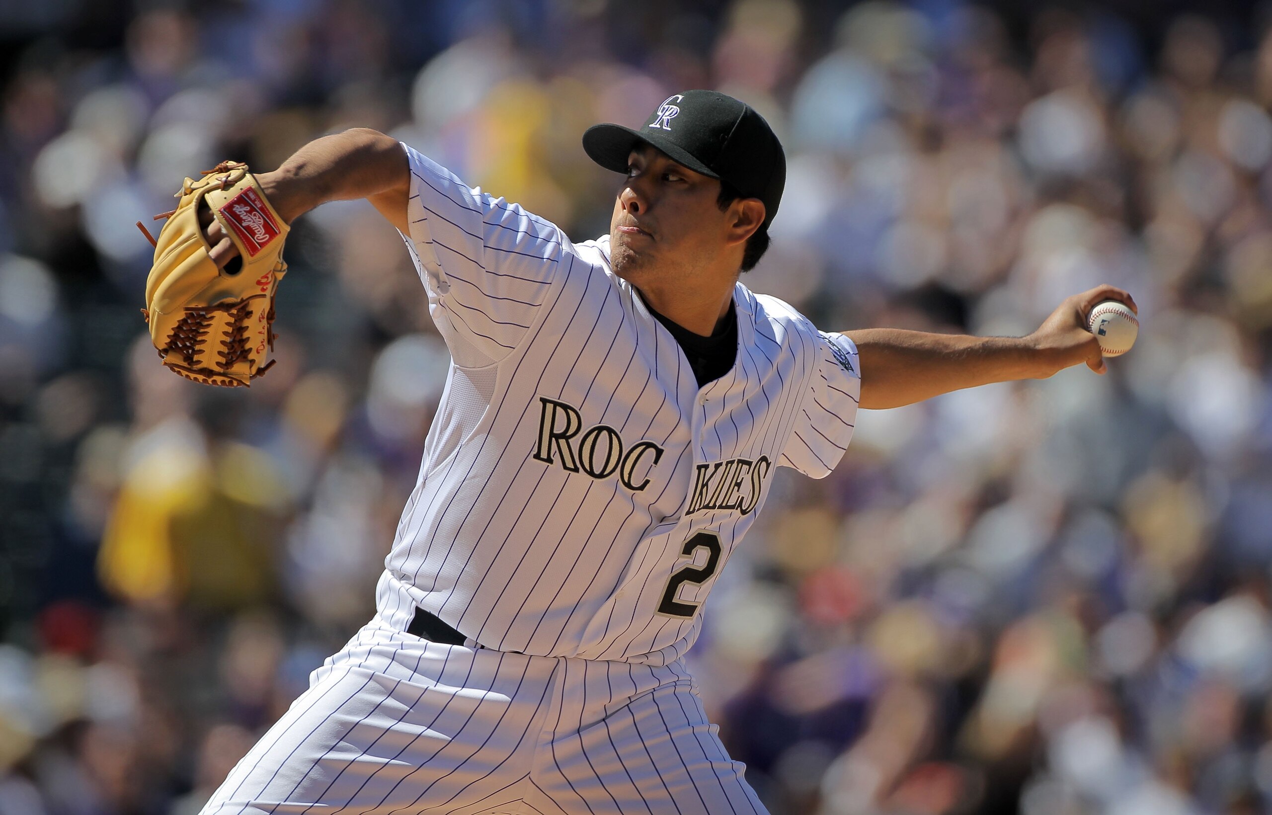 DENVER - APRIL 09:  Starting pitcher Jorge De La Rosa #29 of the Colorado Rockies delivers against the San Diego Padres during MLB action on Opening Day at Coors Field on April 9, 2010 in Denver, Colorado. De La Rosa earned the win as the Rockies defeated