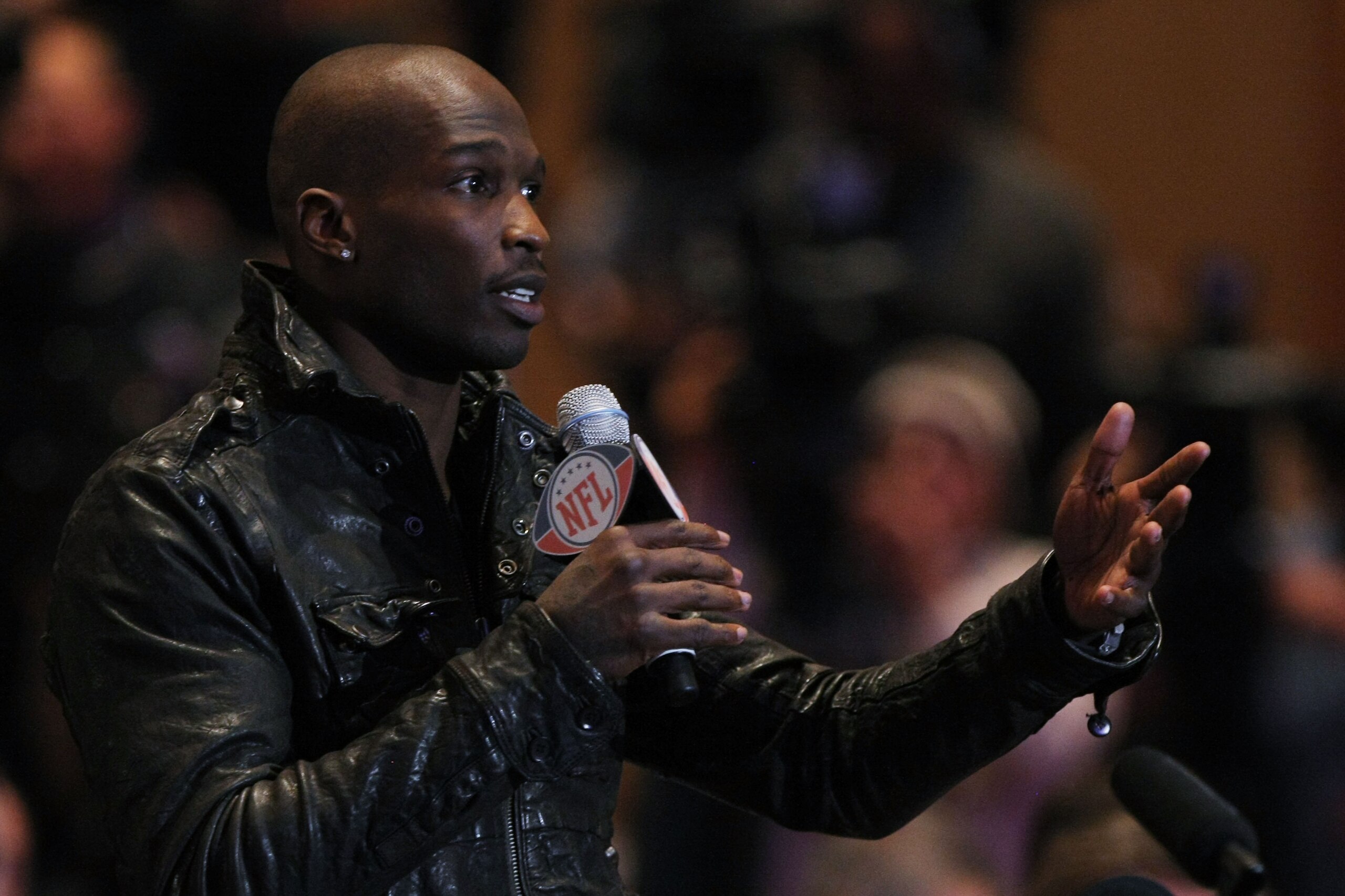 DALLAS, TX - FEBRUARY 04:  Chad Ochocinco of the Cincinnati Bengals asks NFL commissioner Roger Goodell a question during a press conference at the Super Bowl XLV media center on February 4, 2011 in Dallas, Texas. The Green Bay Packers will play the Pitts