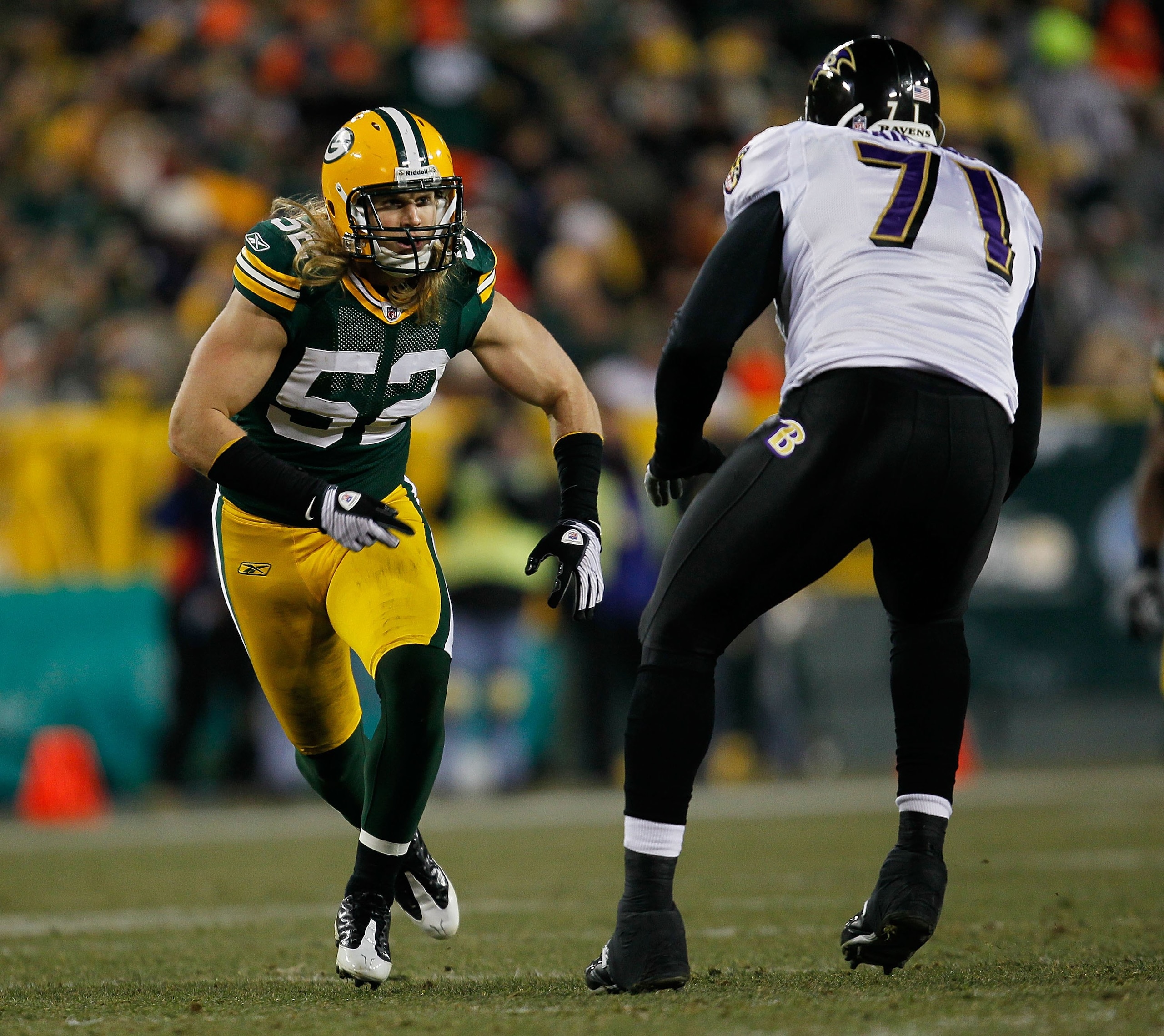 GREEN BAY, WI - DECEMBER 07: Clay Matthews #52 of the Green Bay Packers rushes against Jared Gaither #71 of the Baltimore Ravens at Lambeau Field on December 7, 2009 in Green Bay, Wisconsin. The Packers defeated the Ravens 27-17. (Photo by Jonathan Daniel
