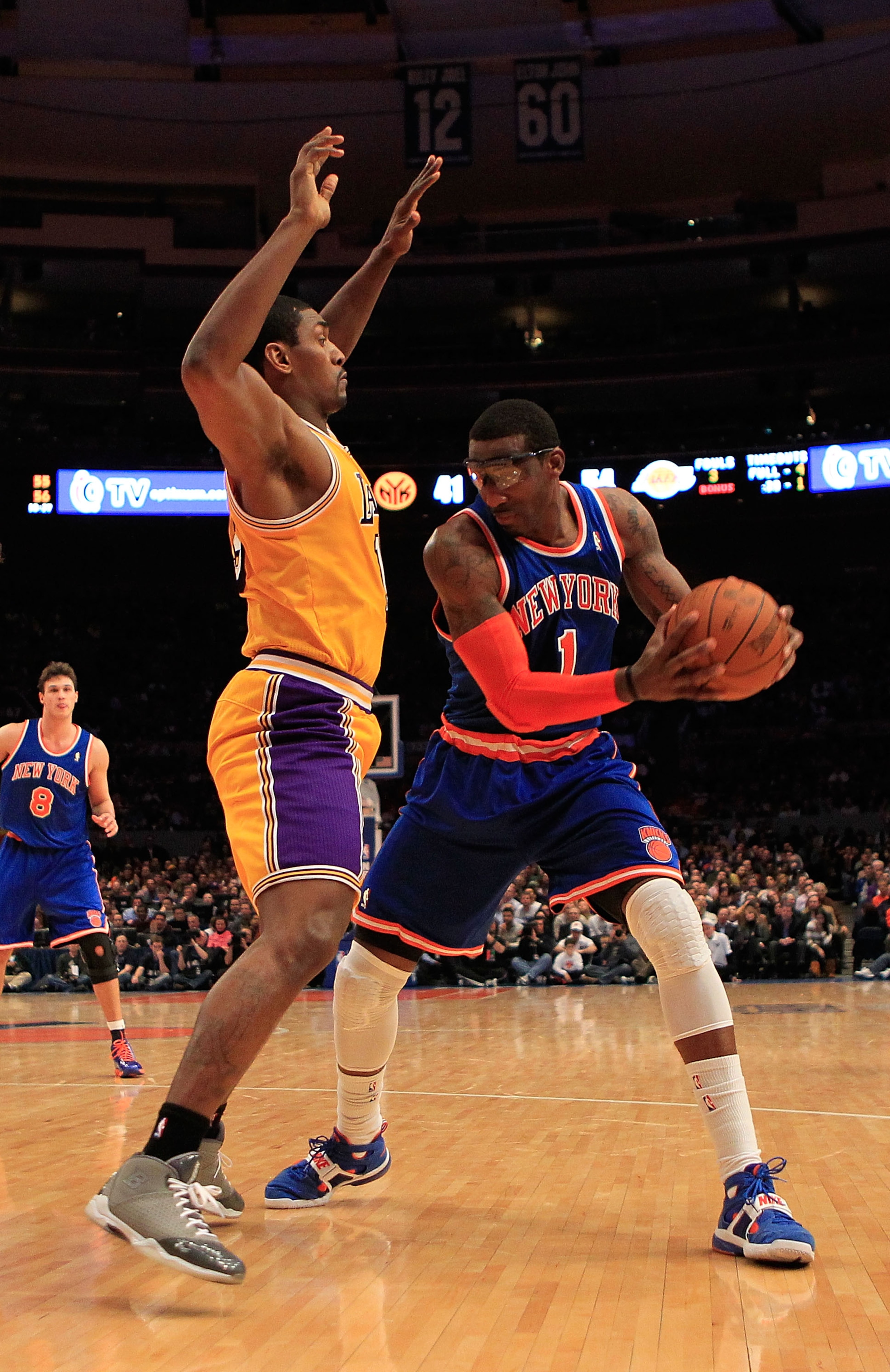 NEW YORK, NY - FEBRUARY 11:  Amar'e Stoudemire #1 of the New York Knicks posts up against Ron Artest #15 of the Los Angeles Lakers at Madison Square Garden on February 11, 2011 in New York City. NOTE TO USER: User expressly acknowledges and agrees that, b