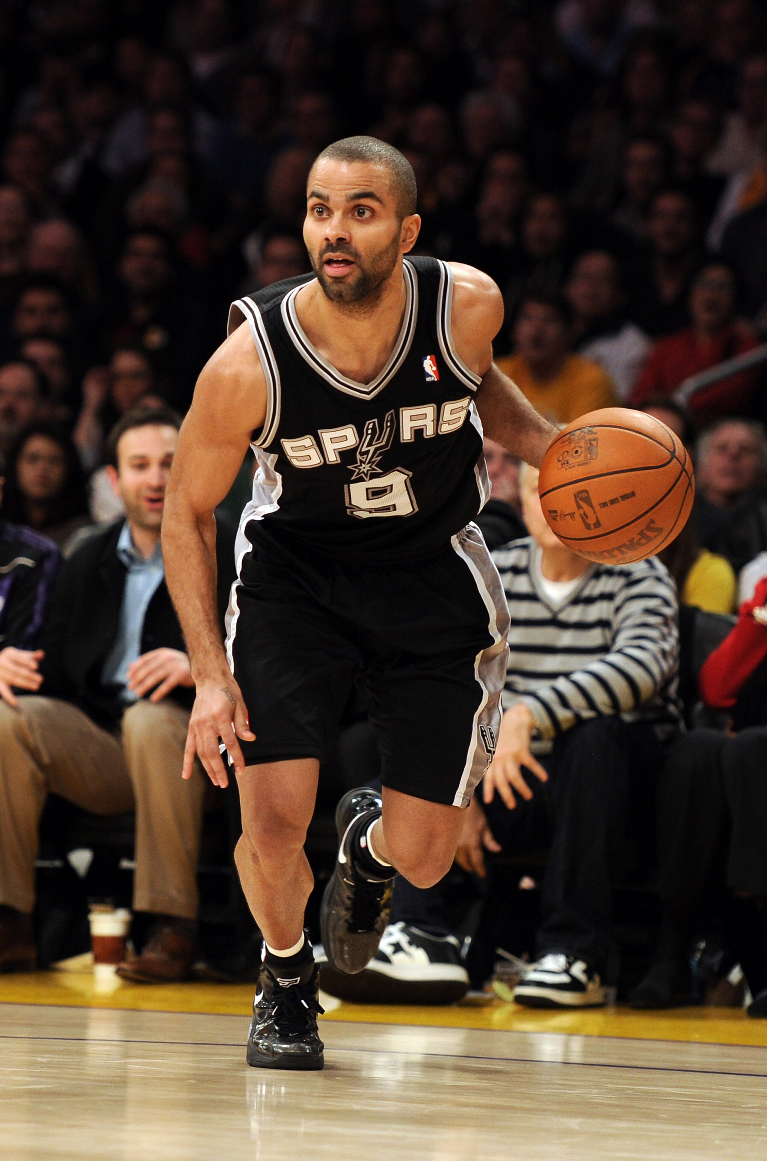 LOS ANGELES, CA - FEBRUARY 03:  Tony Parker #9 of the San Antonio Spurs dribbles from the corner against the Los Angeles Lakers at Staples Center on February 3, 2011 in Los Angeles, California.  NOTE TO USER: User expressly acknowledges and agrees that, b