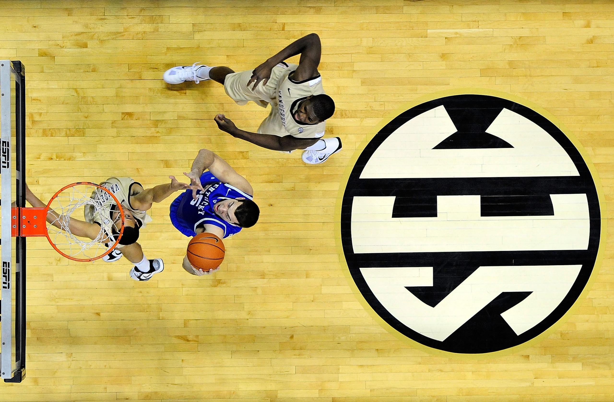 NASHVILLE, TN - FEBRUARY 12:  Josh Harrelson #55 of the Kentucky Wildcats shoots over John Jenkins #23 of the Vanderbilt Commodores at Memorial Gym on February 12, 2011 in Nashville, Tennessee. Vanderbilt won 81-77.  (Photo by Grant Halverson/Getty Images