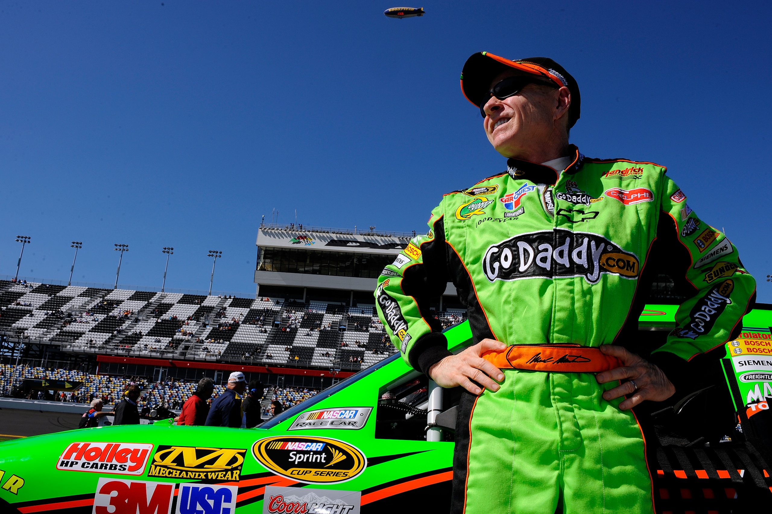DAYTONA BEACH, FL - FEBRUARY 13:  Mark Martin, driver of the #5 GoDaddy.com Chevrolet, stands on the grid during qualifying for the NASCAR Sprint Cup Series Daytona 500 at Daytona International Speedway on February 13, 2011 in Daytona Beach, Florida.  (Ph