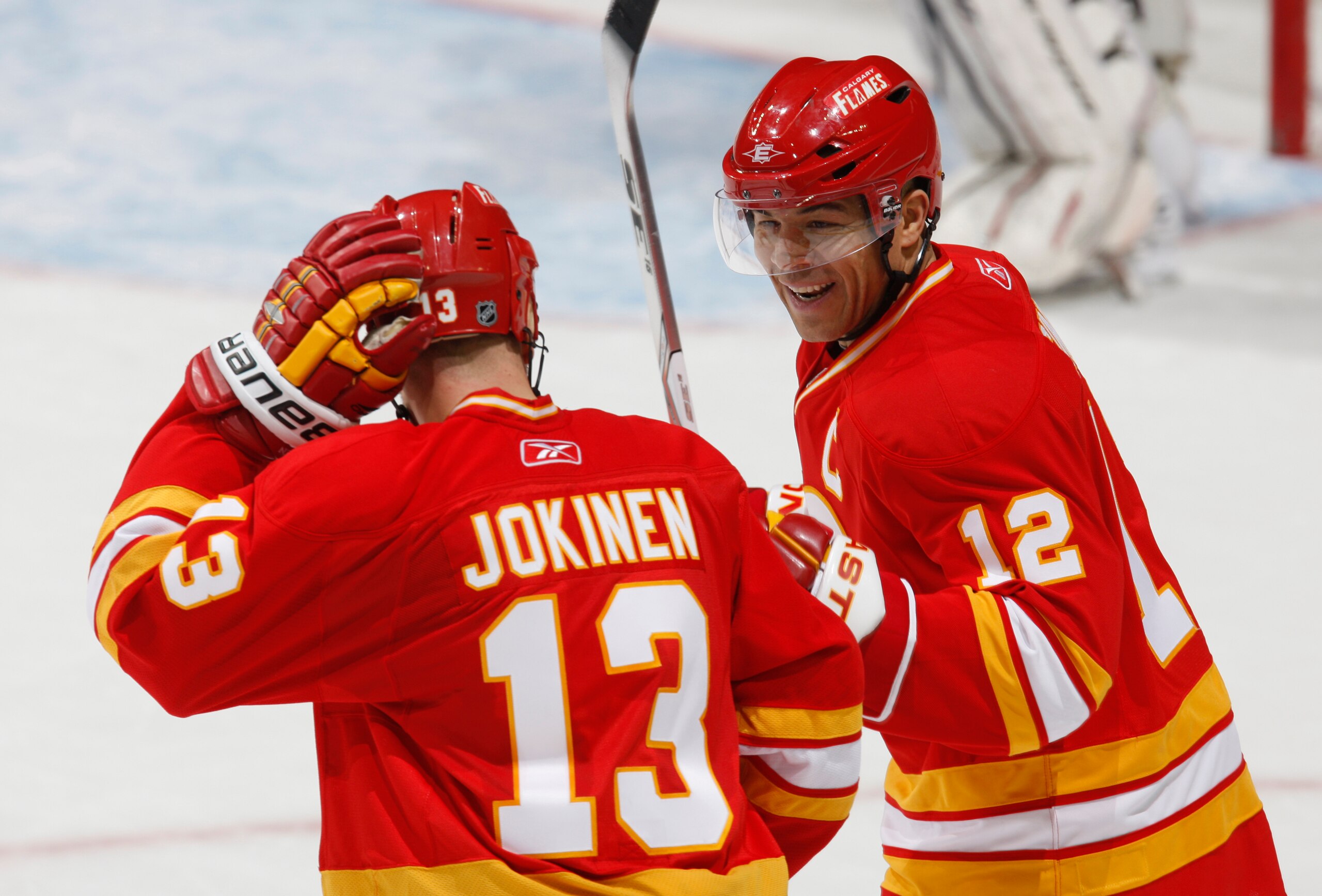 CALGARY, CANADA - FEBRUARY 9: Jarome Iginla #12 of the Calgary Flames celebrates with Olli Jokinen #13 following Olli's goal against the  Ottawa Senators in second period action at Scotiabank Saddledome February 9, 2011 in Calgary, Alberta, Canada. (Photo
