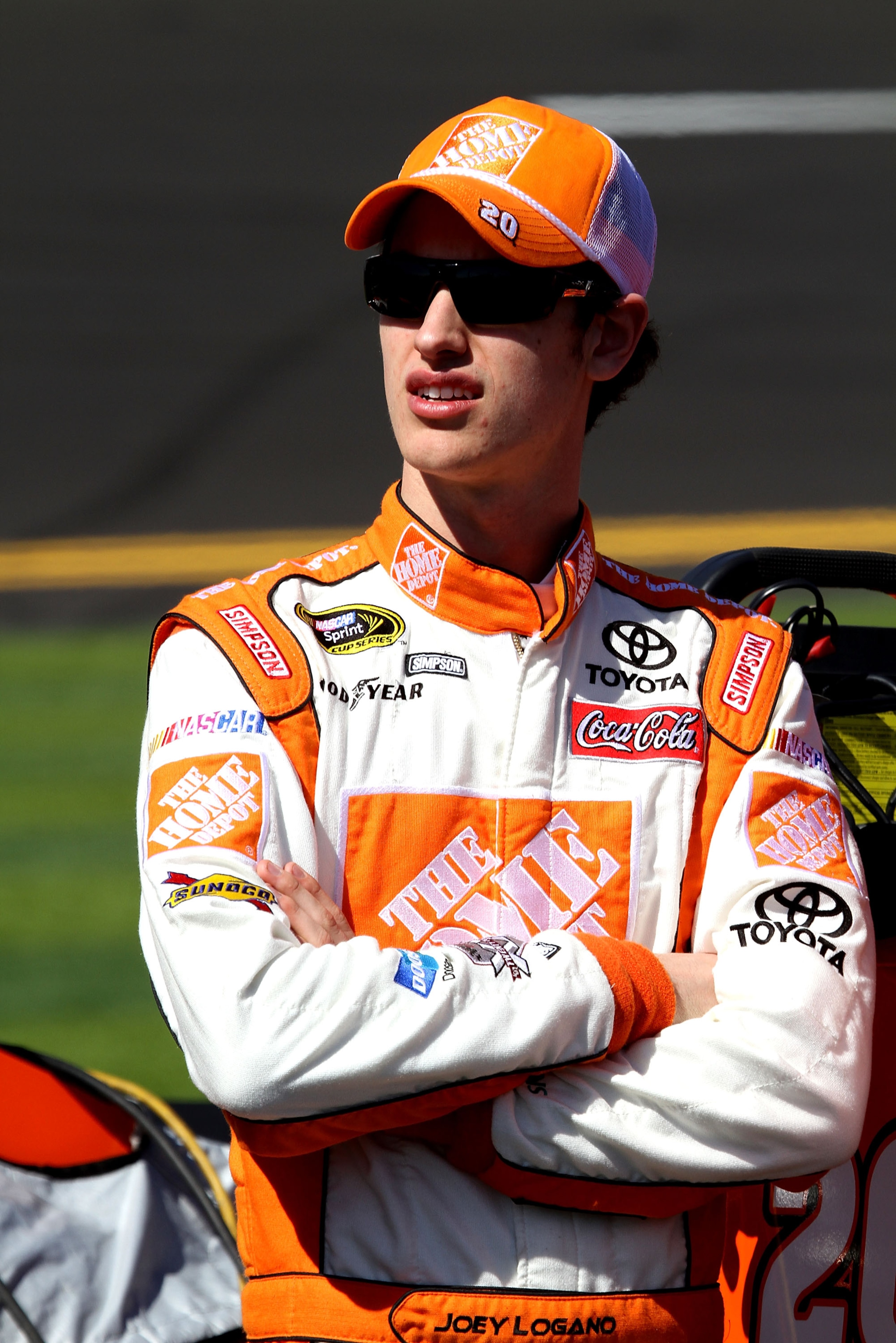 DAYTONA BEACH, FL - FEBRUARY 13:  Joey Logano, driver of the #20 Home Depot Toyota, looks on during qualifying for the NASCAR Sprint Cup Series Daytona 500 at Daytona International Speedway on February 13, 2011 in Daytona Beach, Florida.  (Photo by Jerry