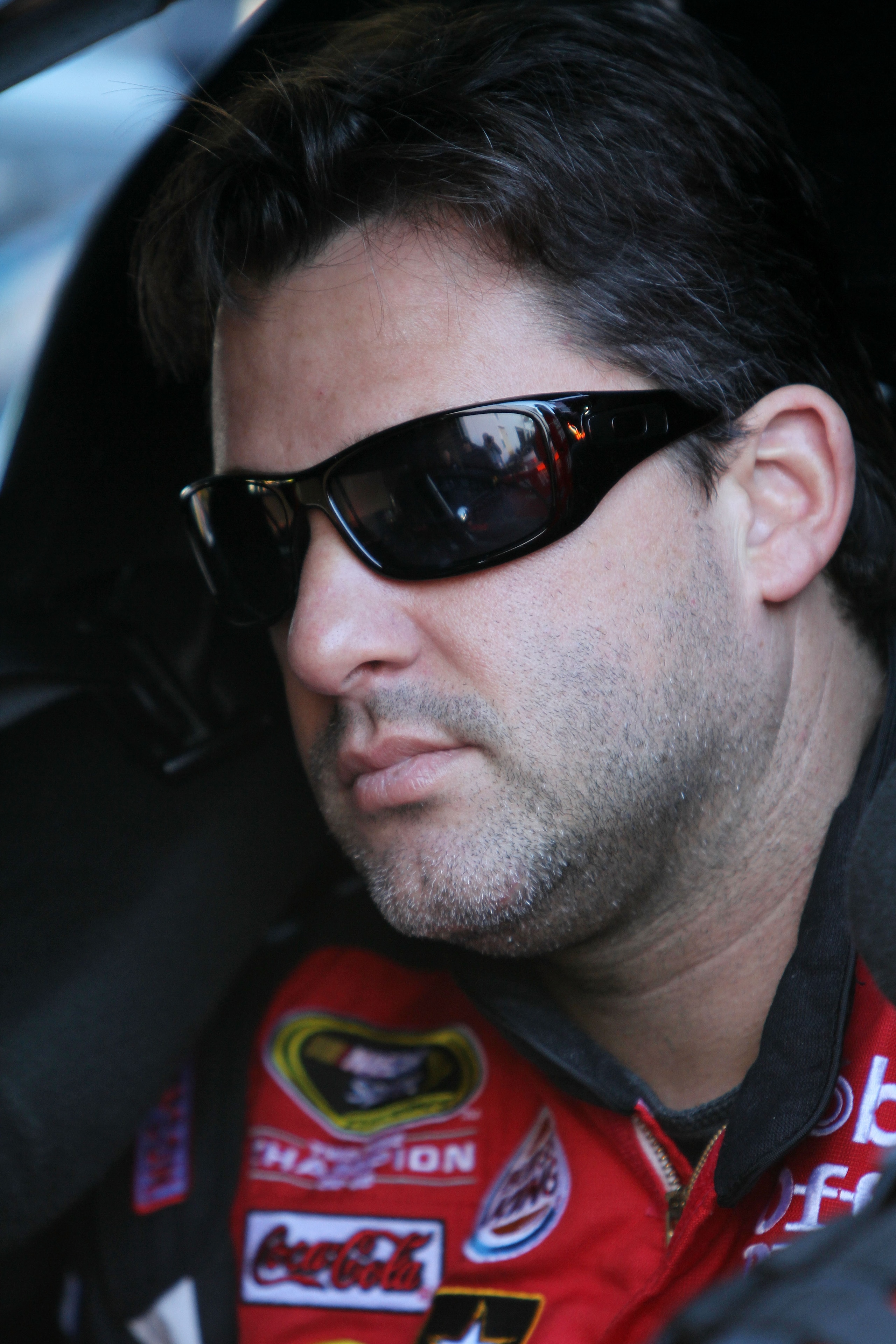 DAYTONA BEACH, FL - FEBRUARY 12:  Tony Stewart, driver of the #14 Mobil 1/Office Depot Chevrolet, sits in his car during practice for the NASCAR Sprint Cup Series Daytona 500 at Daytona International Speedway on February 12, 2011 in Daytona Beach, Florida