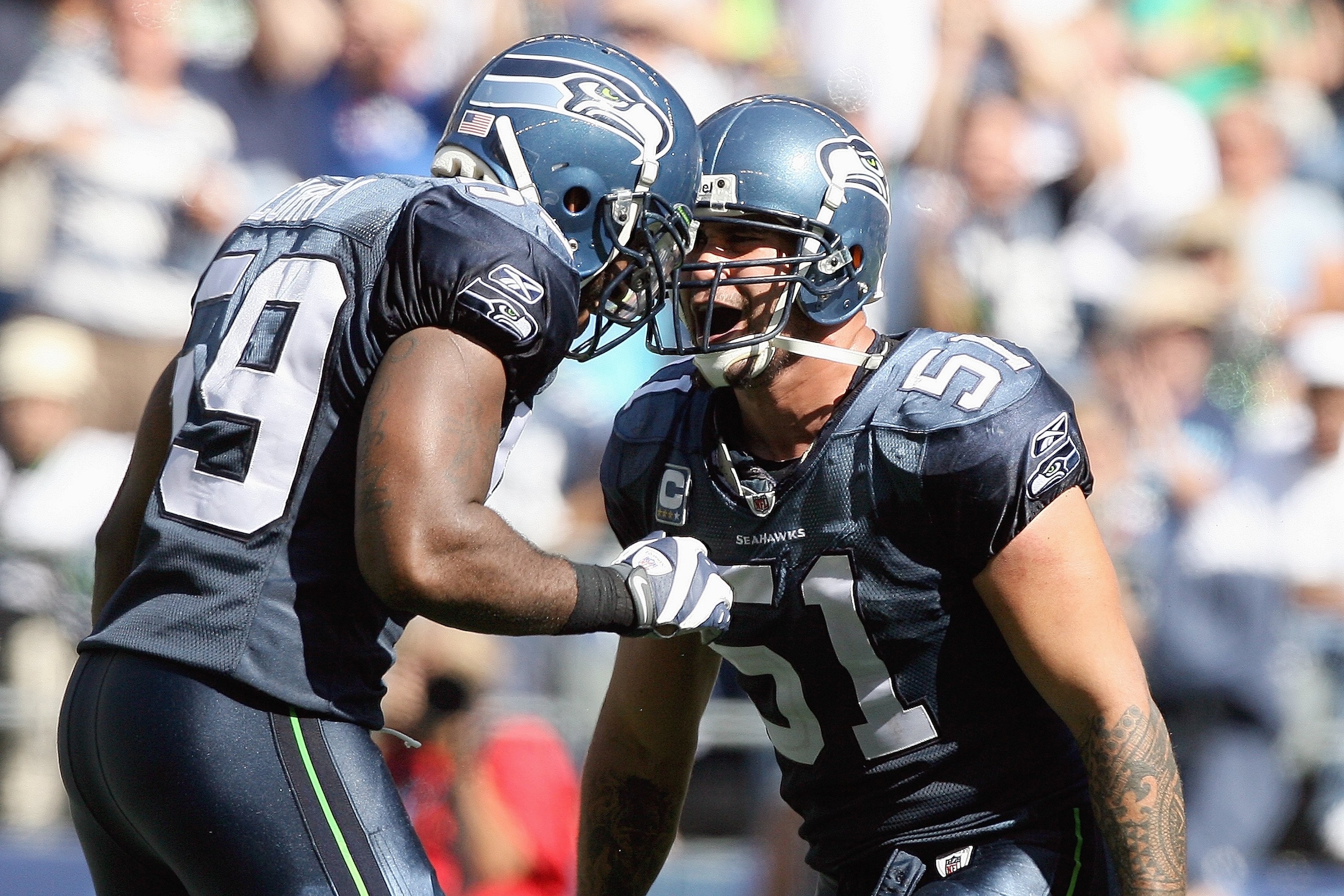 SEATTLE , WA - SEPTEMBER 13: Lofa Tatupu #51 of the Seattle Seahawks celebrates with Aaron Curry #59 during the game against the St. Louis Rams at Qwest Field on September 13, 2009 in Seattle, Washington. (Photo by Otto Greule Jr/Getty Images) SEATTLE , WA - SEPTEMBER 13: Lofa Tatupu #51 of the Seattle Seahawks celebrates with Aaron Curry #59 during the game against the St. Louis Rams at Qwest Field on September 13, 2009 in Seattle, Washington. (Photo by Otto Greule Jr/Getty Images)