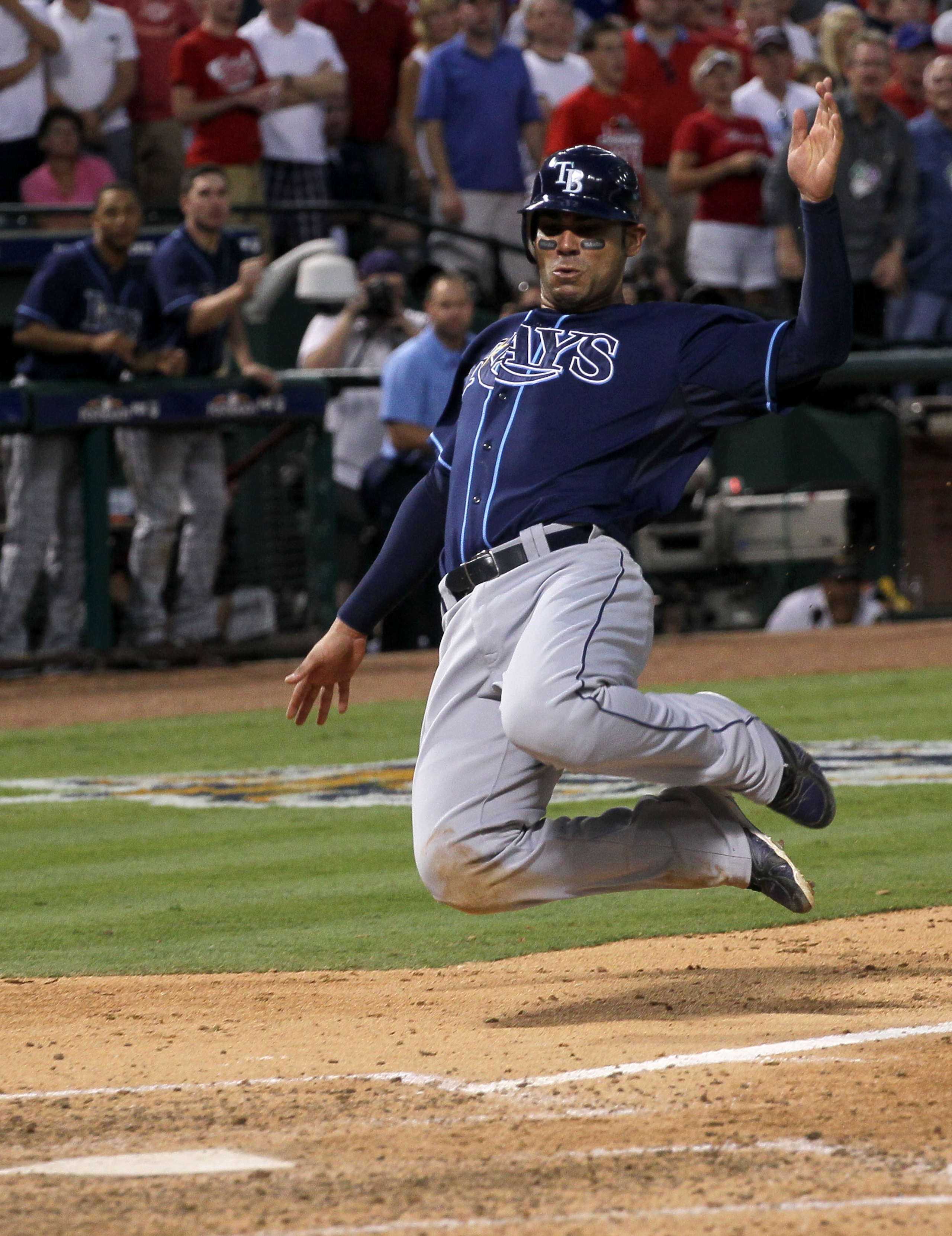 ARLINGTON, TX - OCTOBER 9: Carlos Pena #23 of the Tampa Bay Rays slides home with a run in the eighth inning against the Texas Rangers during game three of the ALDS at Rangers Ballpark in Arlington on October 9, 2010 in Arlington, Texas.  The Rays won 6-3