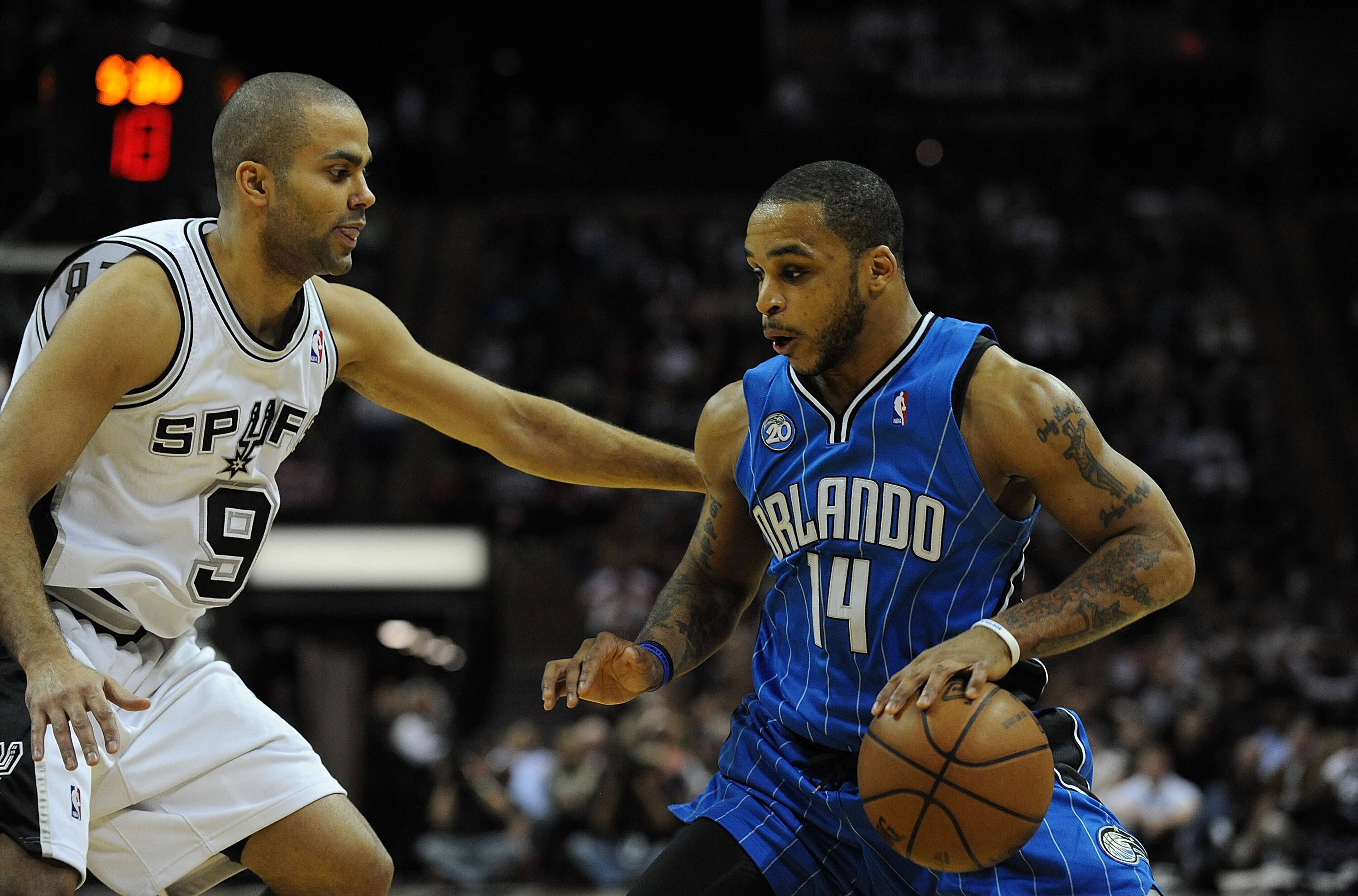 SAN ANTONIO - JANUARY 11:  Guard Jameer Nelson #14 of the Orlando Magic dribbles the ball against Tony Parker #9 of the San Antonio Spurs on January 11, 2009 at AT&T Center in San Antonio, Texas.  NOTE TO USER: User expressly acknowledges and agrees that,