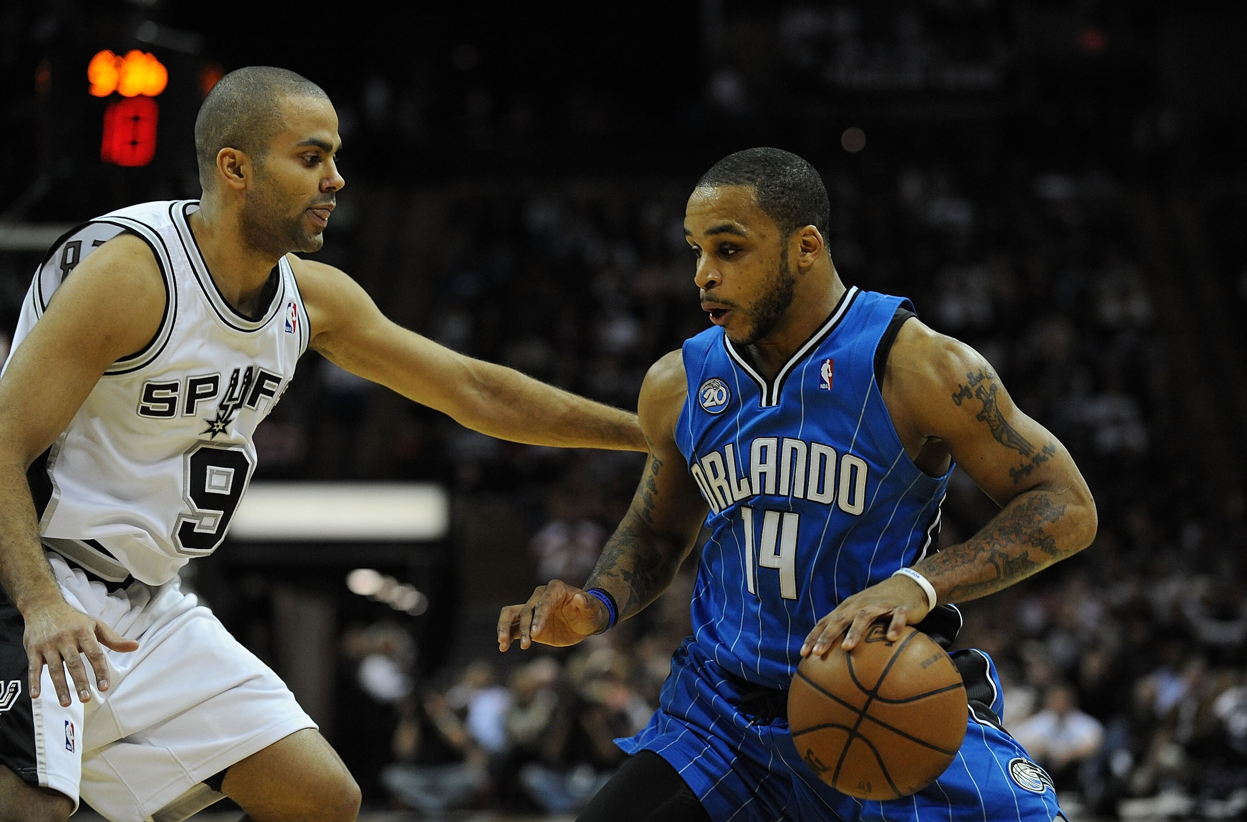 SAN ANTONIO - JANUARY 11:  Guard Jameer Nelson #14 of the Orlando Magic dribbles the ball against Tony Parker #9 of the San Antonio Spurs on January 11, 2009 at AT&T Center in San Antonio, Texas.  NOTE TO USER: User expressly acknowledges and agrees that,