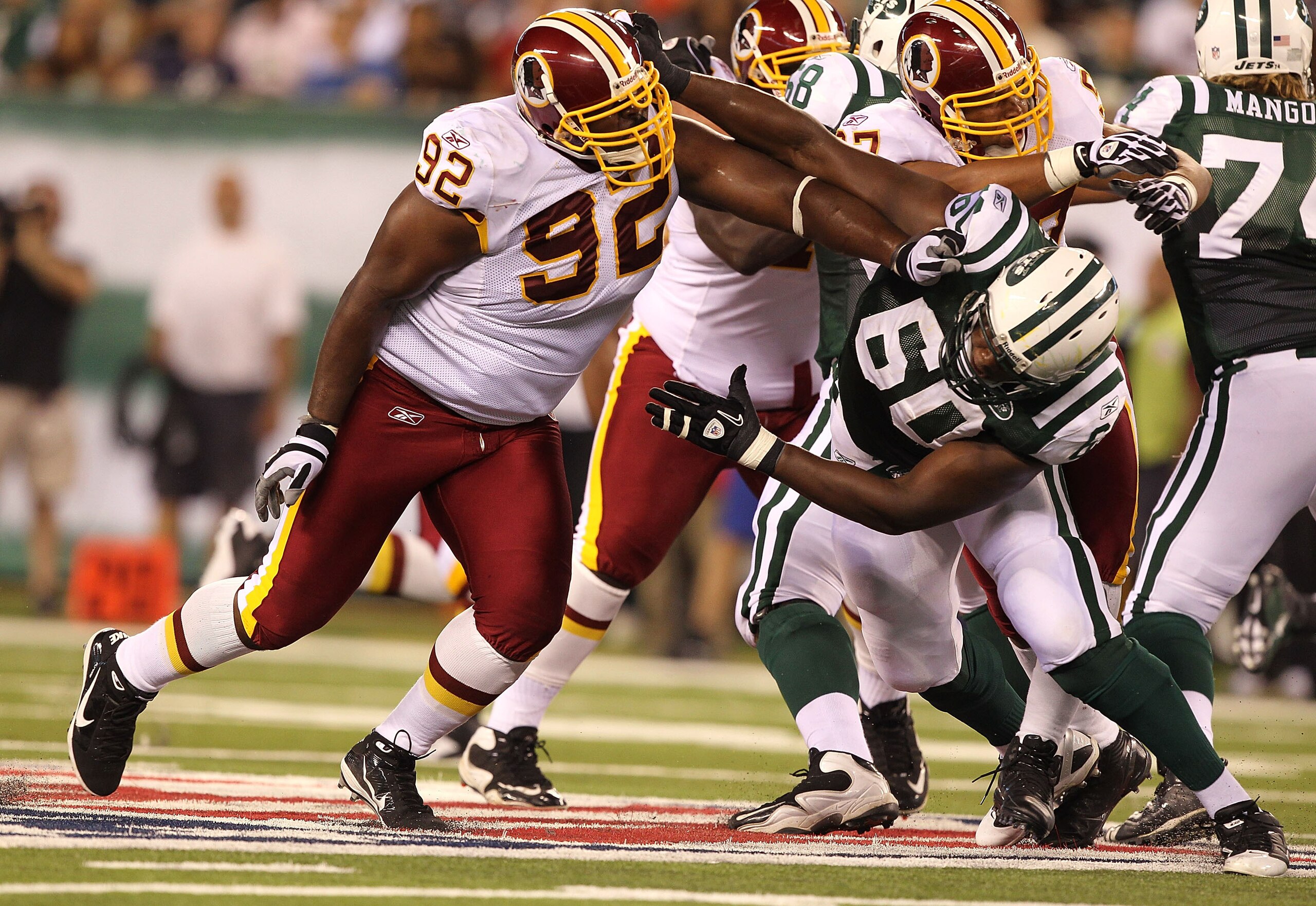 EAST RUTHERFORD, NJ - AUGUST 27:  Albert Haynesworth #92 of the Washington Redskins battles D'Brickashaw Ferguson #60 of the New York Jets during their preseason game on August 27, 2010 at the New Meadowlands Stadium  in East Rutherford, New Jersey.  (Pho