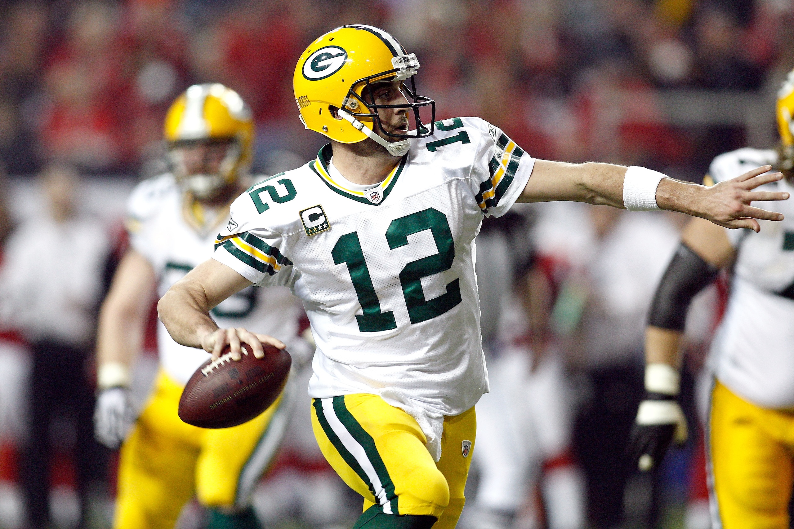 ATLANTA, GA - JANUARY 15:  Aaron Rodgers #12 of the Green Bay Packers looks to pass against the Atlanta Falcons during their 2011 NFC divisional playoff game at Georgia Dome on January 15, 2011 in Atlanta, Georgia. The Packers won 48-21. (Photo by Chris G