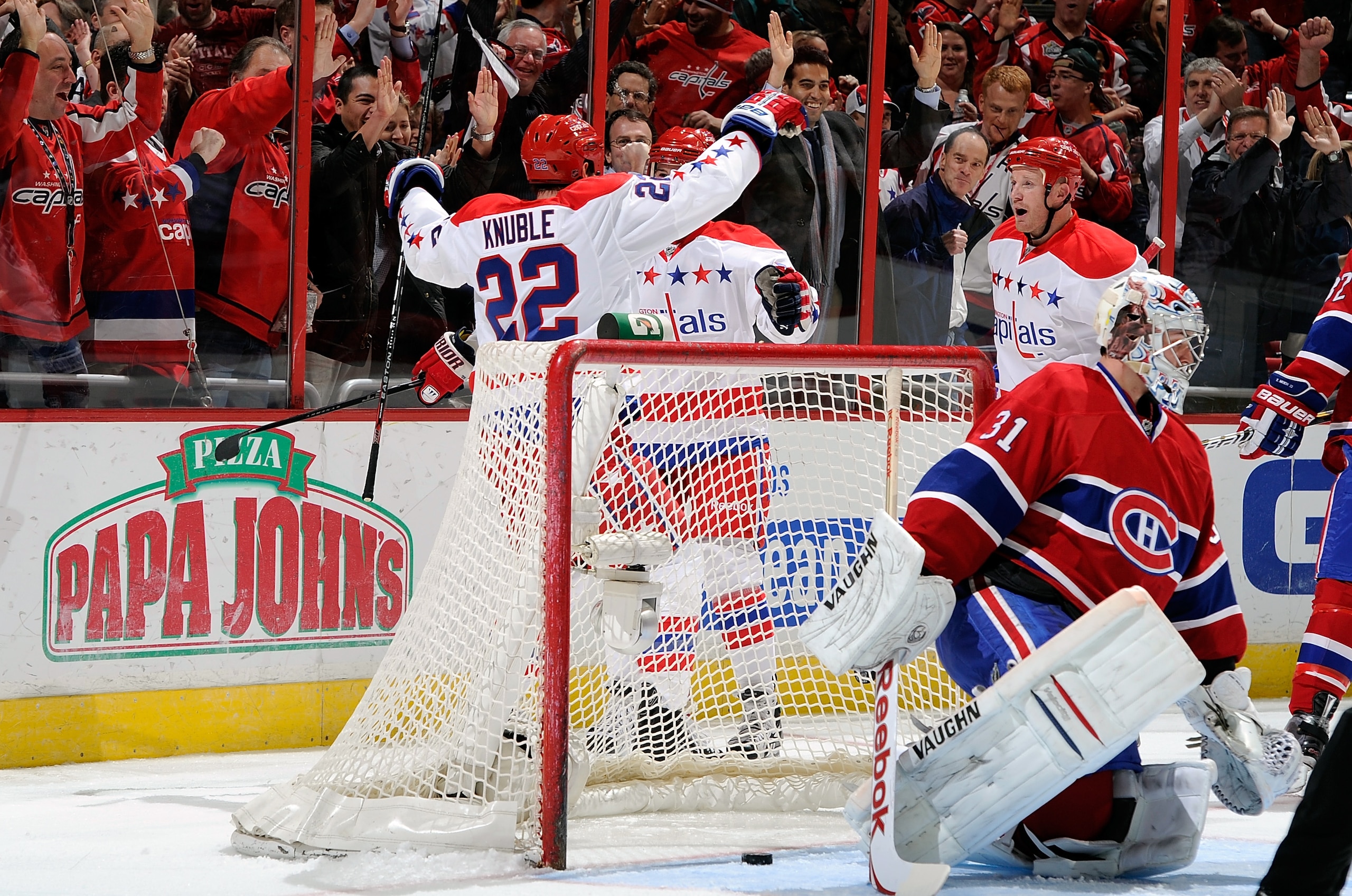 WASHINGTON, DC - FEBRUARY 01:  Mike Knuble #22 of the Washington Capitals celebrates with teammates after scoring in the first period against Carey Price #31 of the Montreal Canadiens at the Verizon Center on February 1, 2011 in Washington, DC.  (Photo by