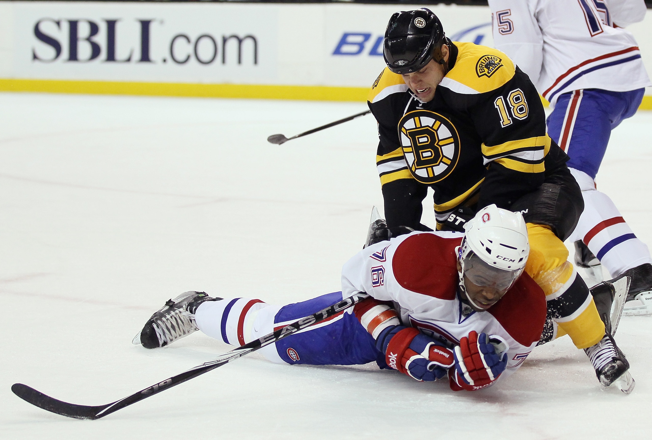 BOSTON, MA - FEBRUARY 09:  Nathan Horton #18 of the Boston Bruins shoves P.K. Subban #76 of the Montreal Canadiens on February 9, 2011 at the TD Garden in Boston, Massachusetts.  (Photo by Elsa/Getty Images)