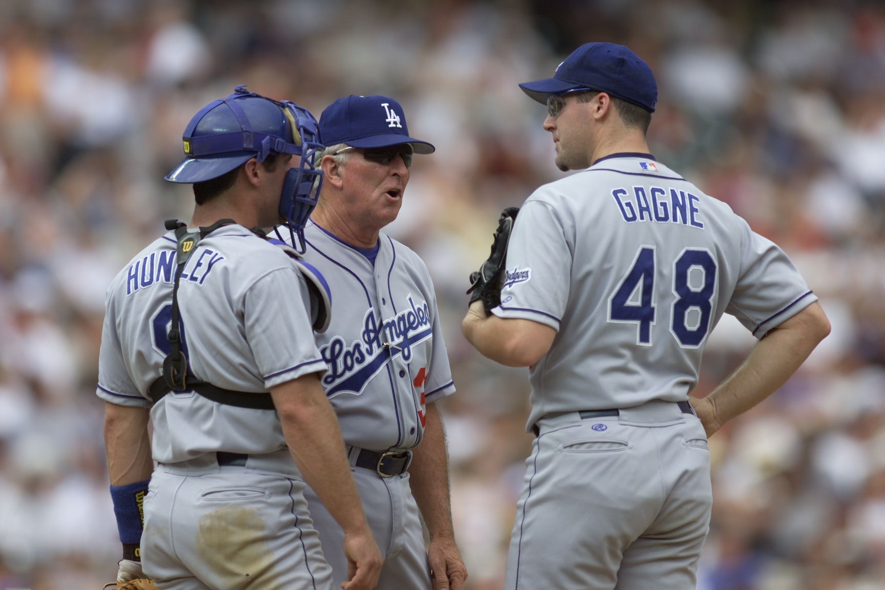 27 Jul 2000:  Pitching Coach Claude Osteen #38, Pitcher Eric Gagne #48, and Catcher Todd Hundley #9 of the Los Angeles Dodgers have a discussion on the mound during the game against the Colorado Rockies at Coors Field in Denver, Colorado.  The Dodgers def