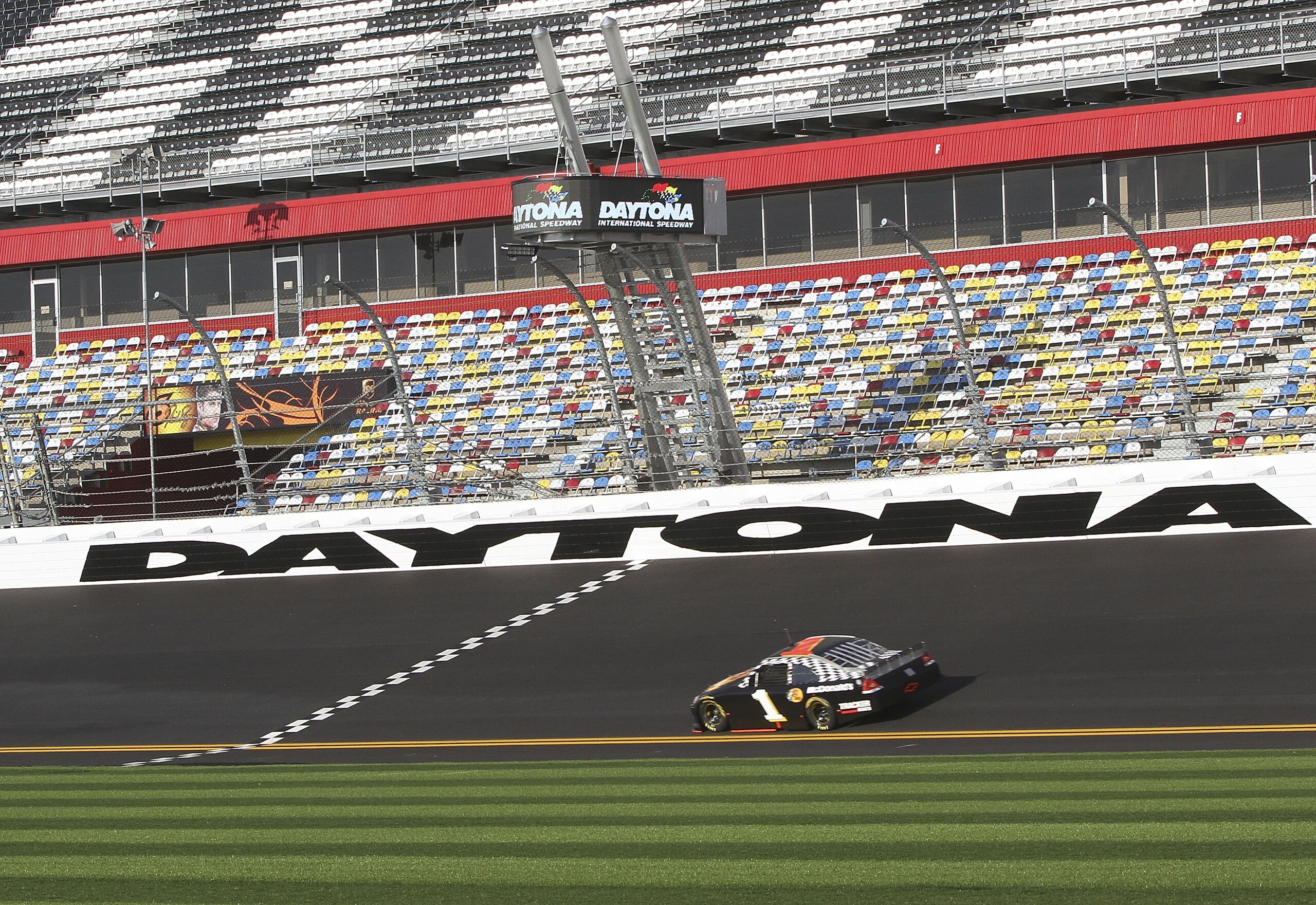 DAYTONA BEACH, FL - JANUARY 20:  Jamie McMurray, driver of the #1 Bass Pro Shops Chevrolet drives on the new pavement during testing at Daytona International Speedway on January 20, 2011 in Daytona Beach, Florida.  (Photo by Jerry Markland/Getty Images fo