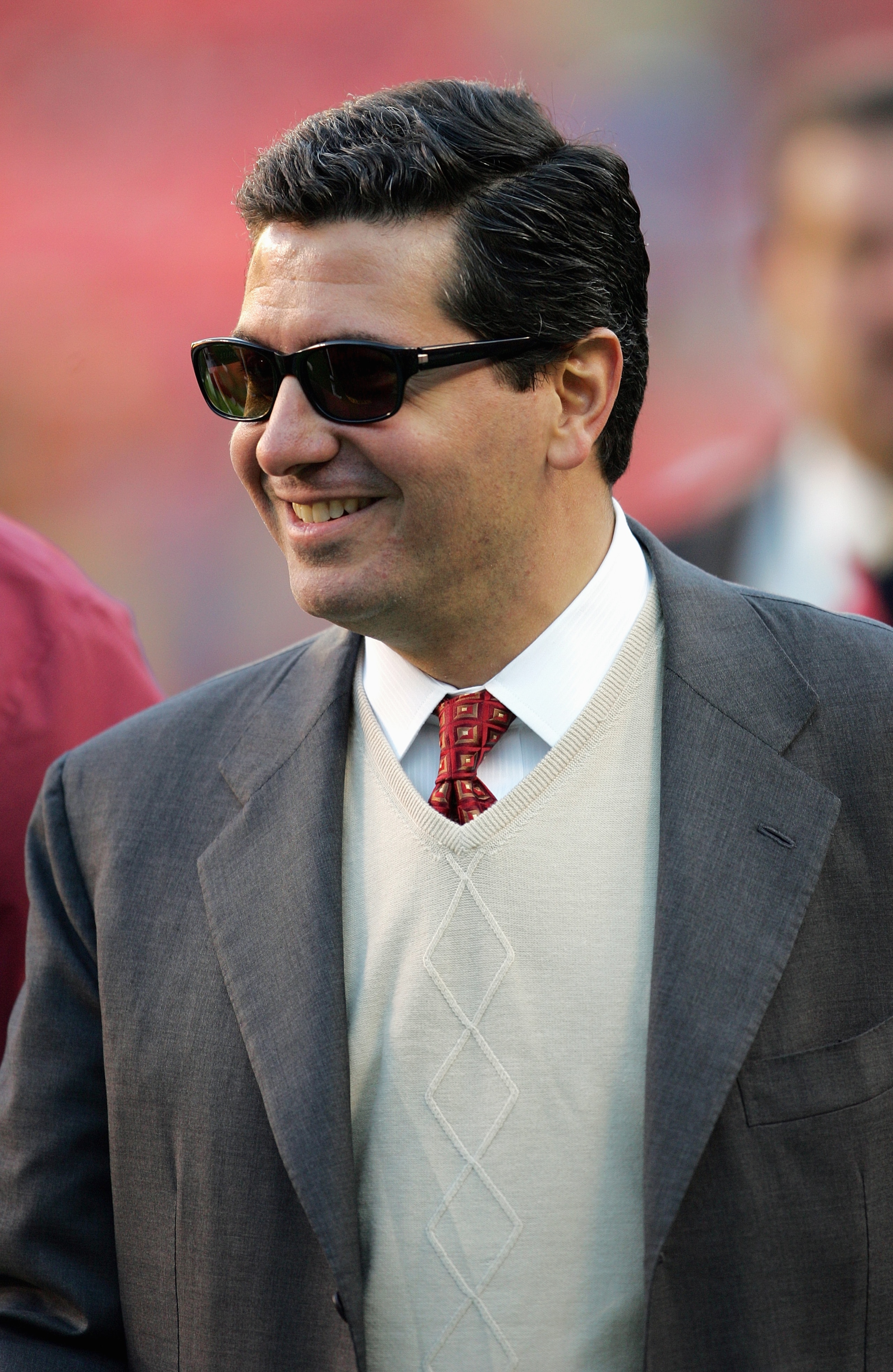 LANDOVER, MD - NOVEMBER 15:  Owner Dan Snyder of the Washington Redskins smiles on the field while his team faces the Cincinnati Bengals during the game at FedEx Field on December 12, 2004 in Landover, Maryland.  The Bengals defeated the Redskins 17-10.