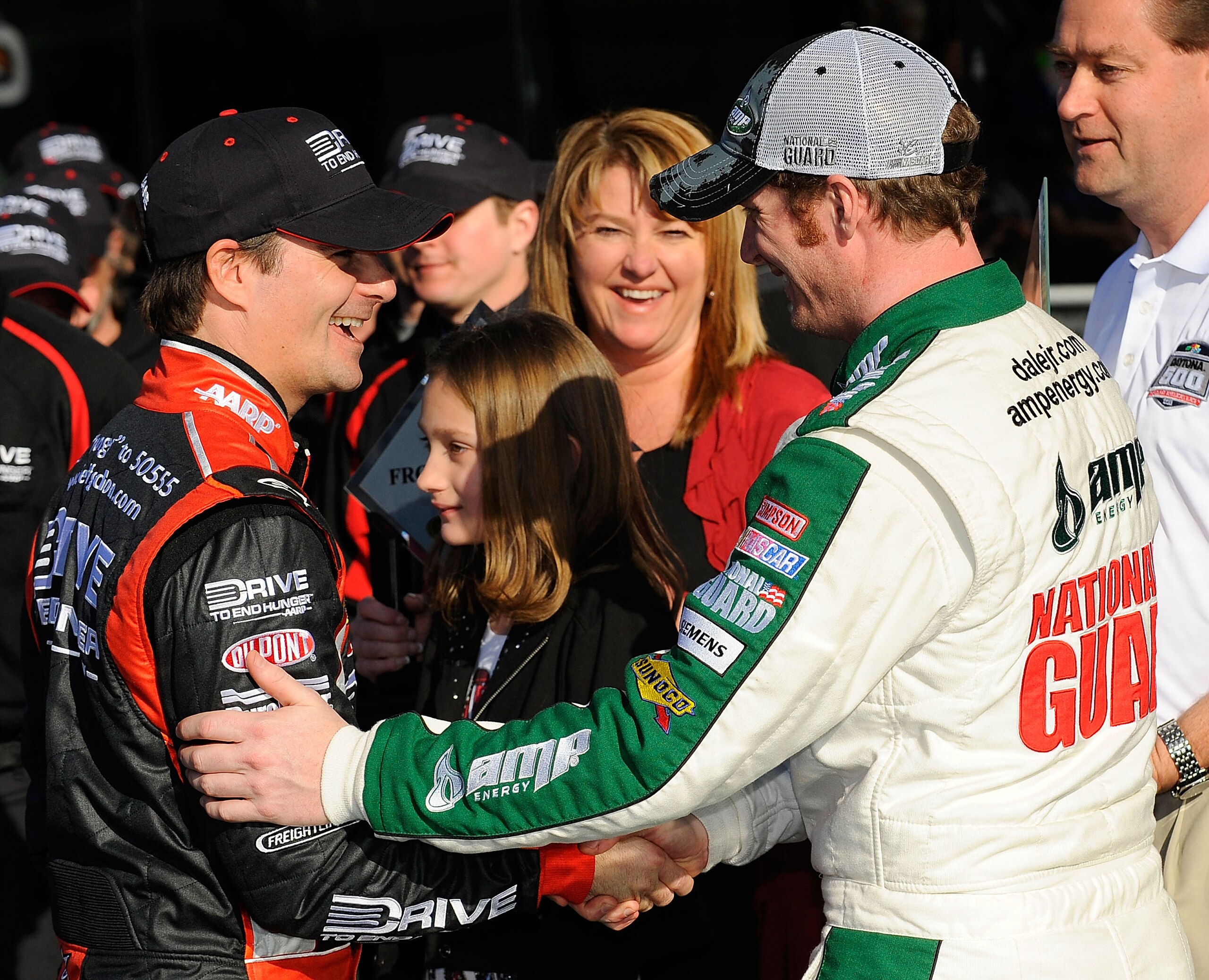 DAYTONA BEACH, FL - FEBRUARY 13:  Front Row award winner Jeff Gordon, driver of the #24 Drive to End Hunger Chevrolet, and Pole award winner Dale Earnhardt Jr., driver of the #88 National Guard/AMP Energy Chevrolet, shake hands in victory lane after quali