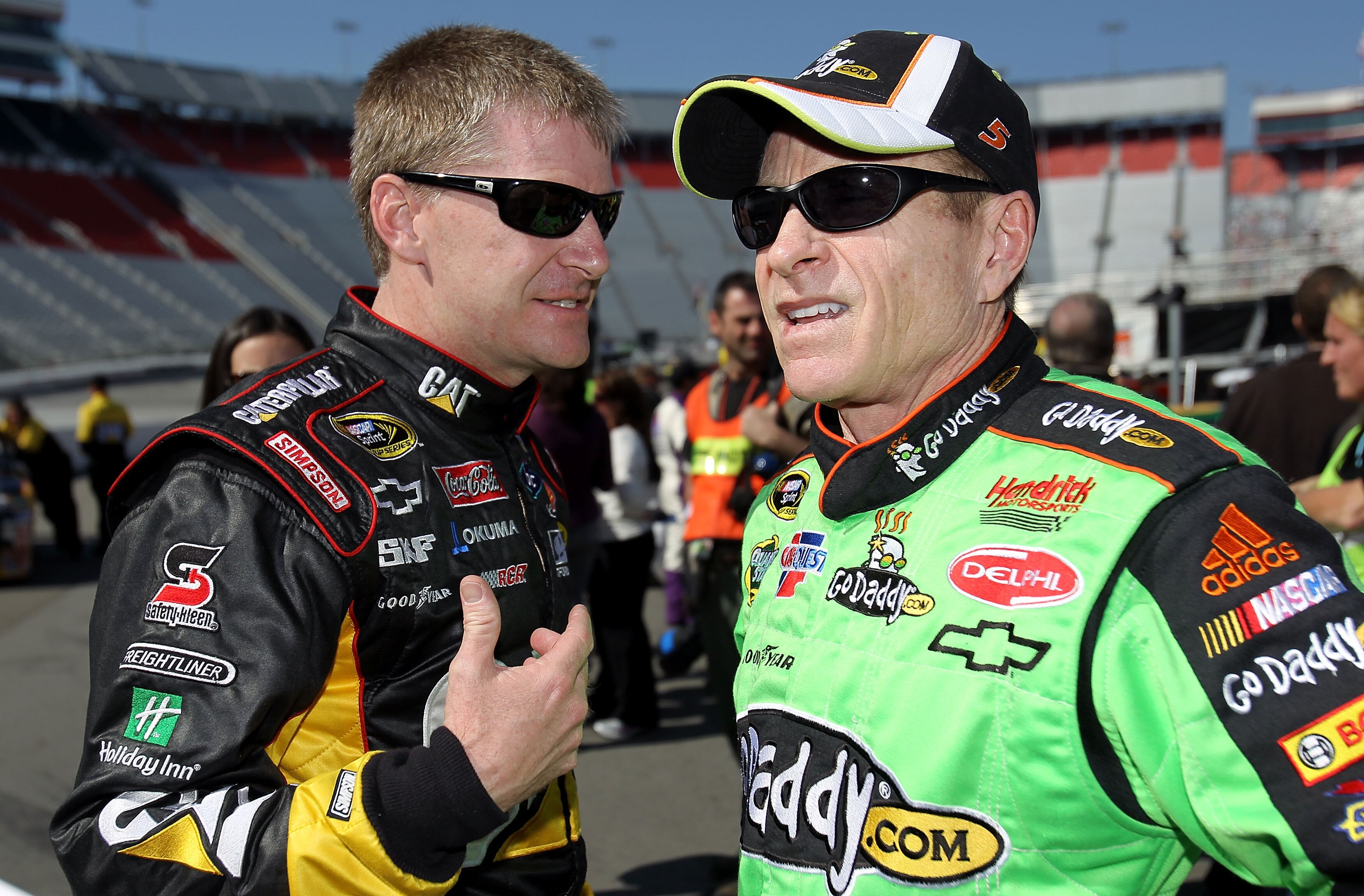 BRISTOL, TN - MARCH 19:  Jeff Burton (L), driver of the #31 Caterpillar Chevrolet, talks with Mark Martin, driver of the #5 GoDaddy.com Chevrolet, in the garage area  after qualifying for the NASCAR Sprint Cup Series Food City 500 at Bristol Motor Speedwa