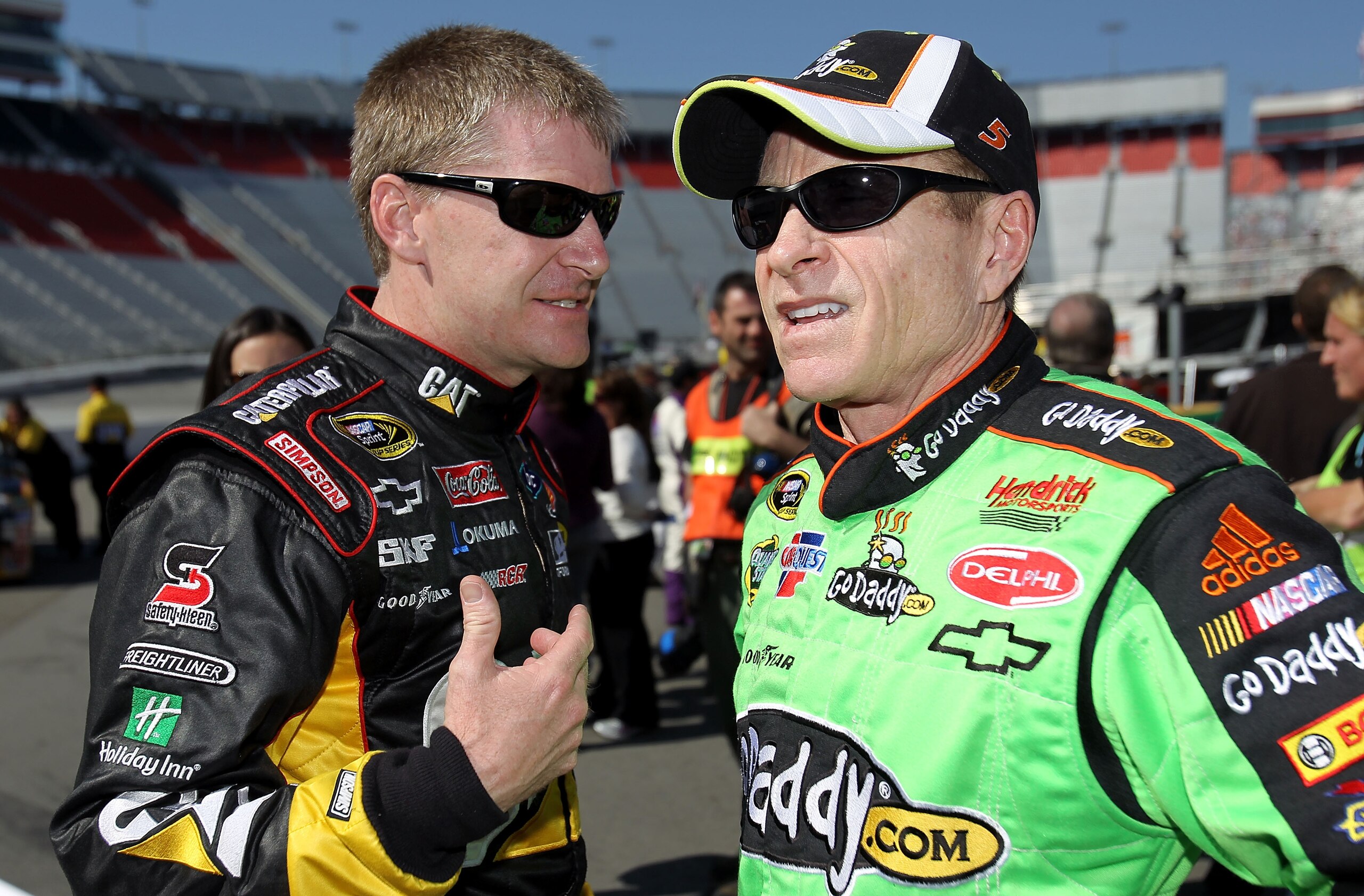 BRISTOL, TN - MARCH 19:  Jeff Burton (L), driver of the #31 Caterpillar Chevrolet, talks with Mark Martin, driver of the #5 GoDaddy.com Chevrolet, in the garage area  after qualifying for the NASCAR Sprint Cup Series Food City 500 at Bristol Motor Speedwa
