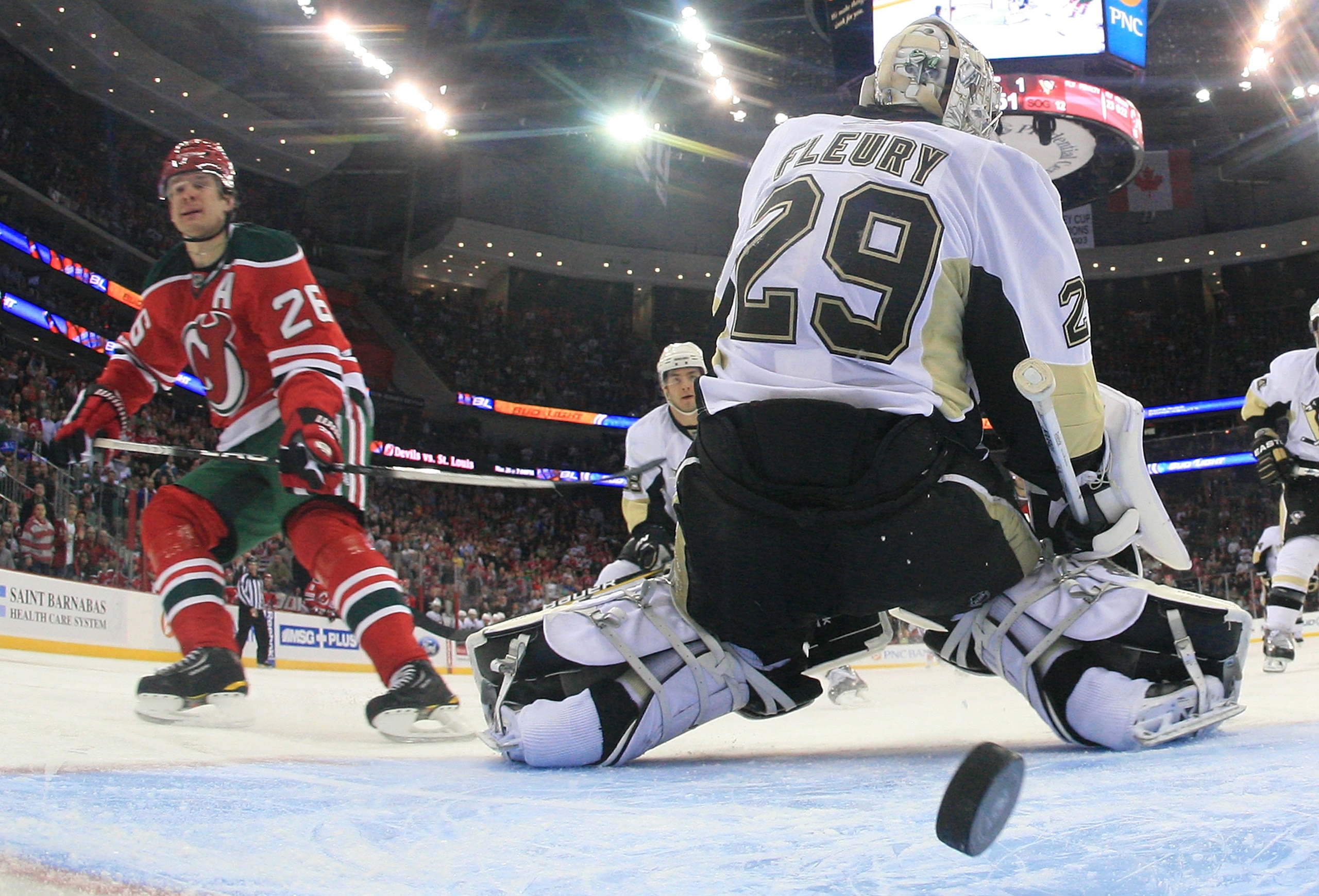 NEWARK, NJ - MARCH 17: Patrik Elias #26 of the New Jersey Devils scores a second period goal past Marc-Andre Fleury #29 of the Pittsburgh Penguins at the Prudential Center on March 17, 2010 in Newark, New Jersey. The Devils defeated the Penguins 5-2. (Pho