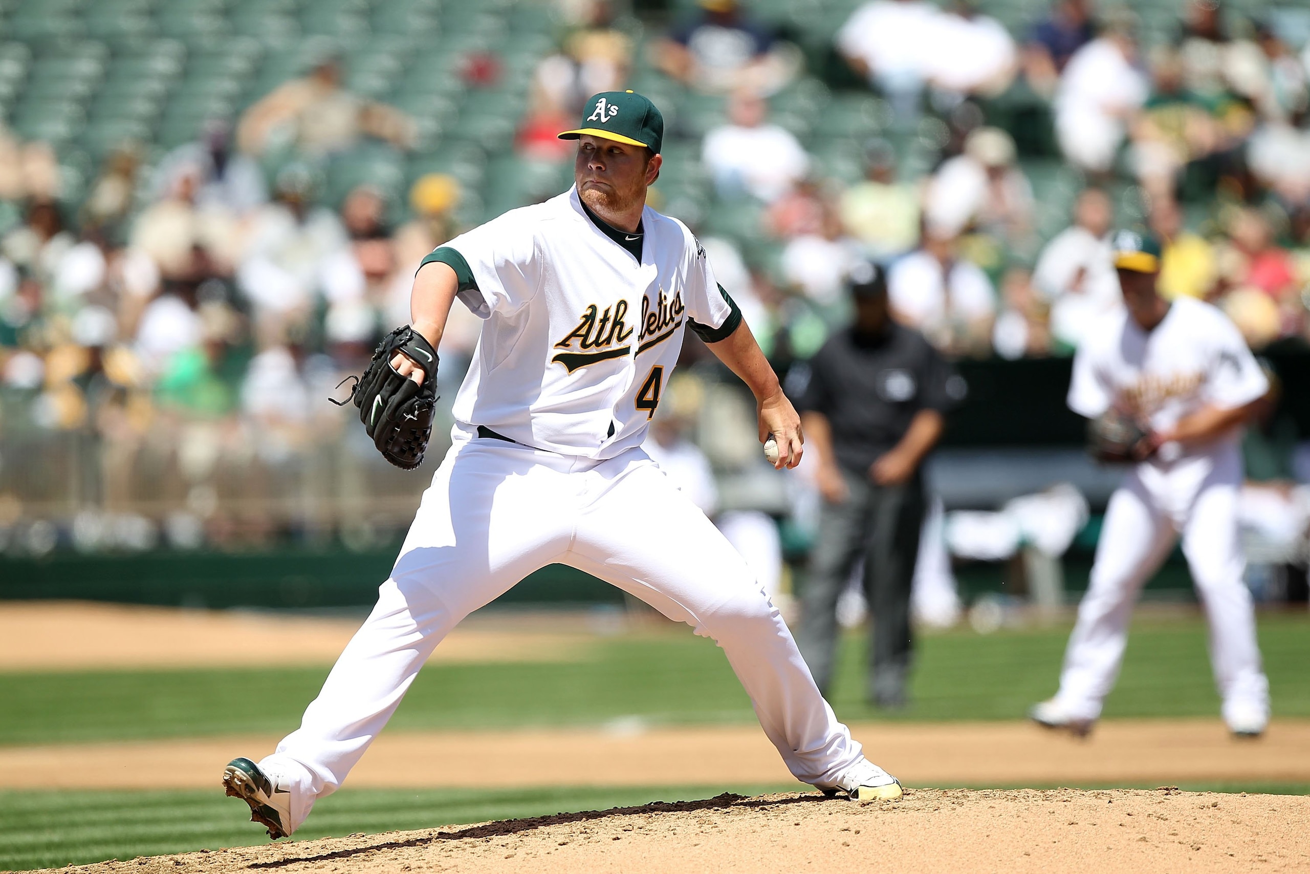 OAKLAND, CA - APRIL 08:  Brett Anderson #49 of the Oakland Athletics pitches against the Seattle Mariners during an MLB game at the Oakland-Alameda County Coliseum on April 8, 2010 in Oakland, California.  (Photo by Jed Jacobsohn/Getty Images)