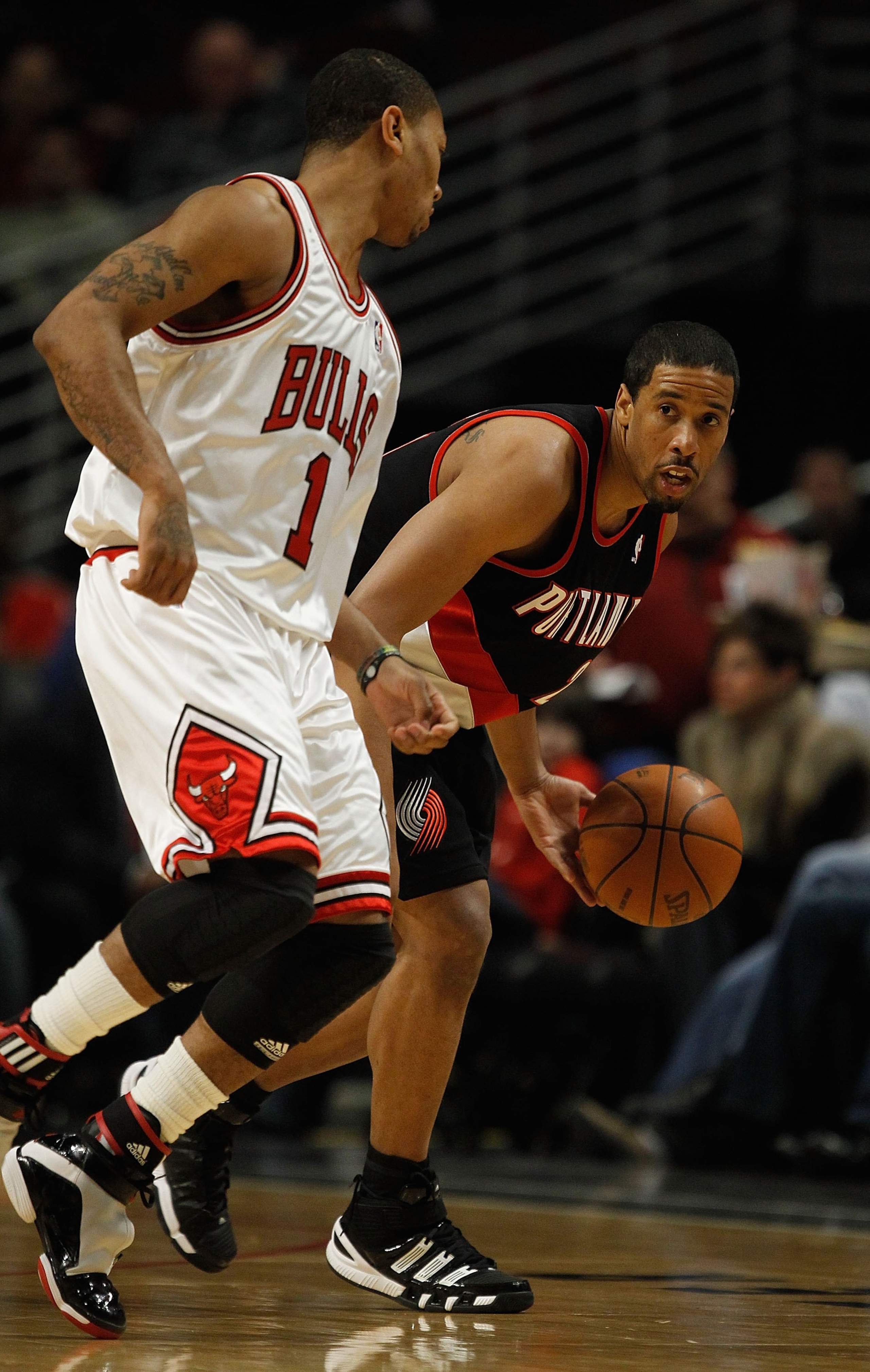 CHICAGO - FEBRUARY 26: Andre Miller #24 of the Portland Trail Blazers looks to pass as Derrick Rose #1 of the Chicago Bulls defends at the United Center on February 26, 2010 in Chicago, Illinois. The Bulls defeated the Trail Blazers 115-111 in overtime. N CHICAGO - FEBRUARY 26: Andre Miller #24 of the Portland Trail Blazers looks to pass as Derrick Rose #1 of the Chicago Bulls defends at the United Center on February 26, 2010 in Chicago, Illinois. The Bulls defeated the Trail Blazers 115-111 in overtime. N