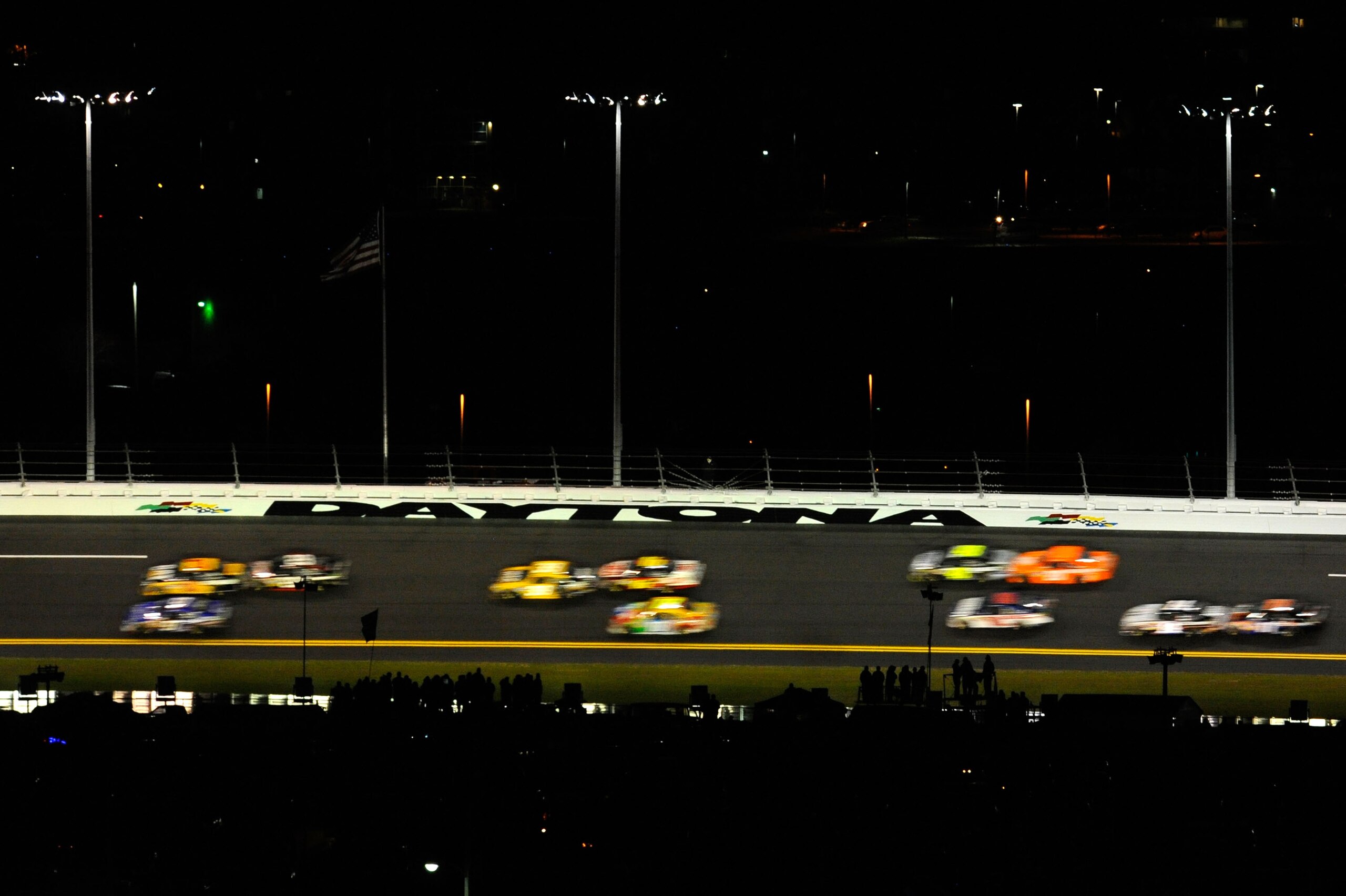 DAYTONA BEACH, FL - FEBRUARY 12:  A view of cars racing during the NASCAR Budweiser Shootout at Daytona International Speedway on February 12, 2011 in Daytona Beach, Florida.  (Photo by Jared C. Tilton/Getty Images for NASCAR)