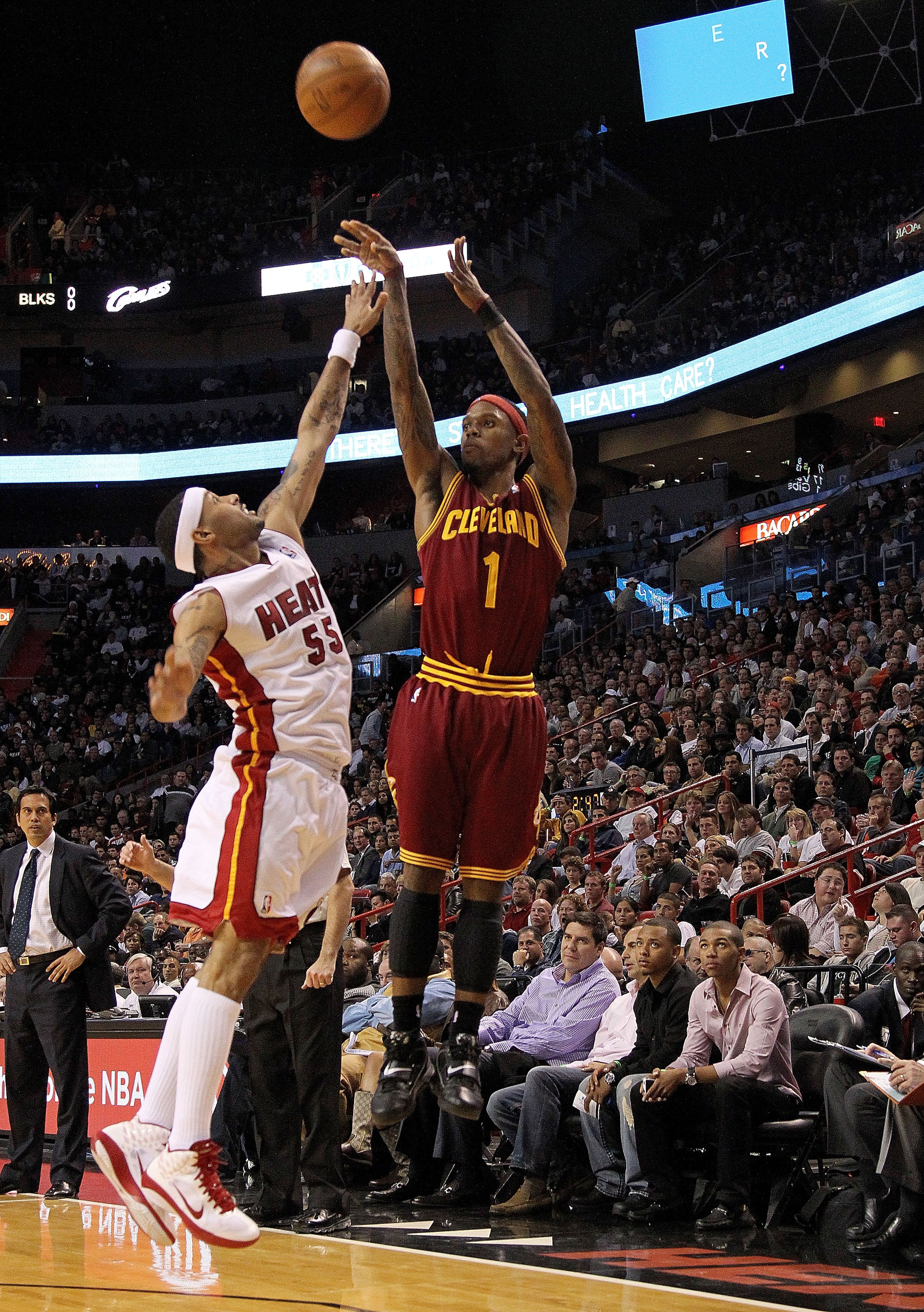 MIAMI, FL - DECEMBER 15: Daniel Gibson #1 of the Cleveland Cavaliers shoots over Eddie House #55 of the Miami Heat during a game at American Airlines Arena on December 15, 2010 in Miami, Florida. NOTE TO USER: User expressly acknowledges and agrees that MIAMI, FL - DECEMBER 15: Daniel Gibson #1 of the Cleveland Cavaliers shoots over Eddie House #55 of the Miami Heat during a game at American Airlines Arena on December 15, 2010 in Miami, Florida. NOTE TO USER: User expressly acknowledges and agrees that
