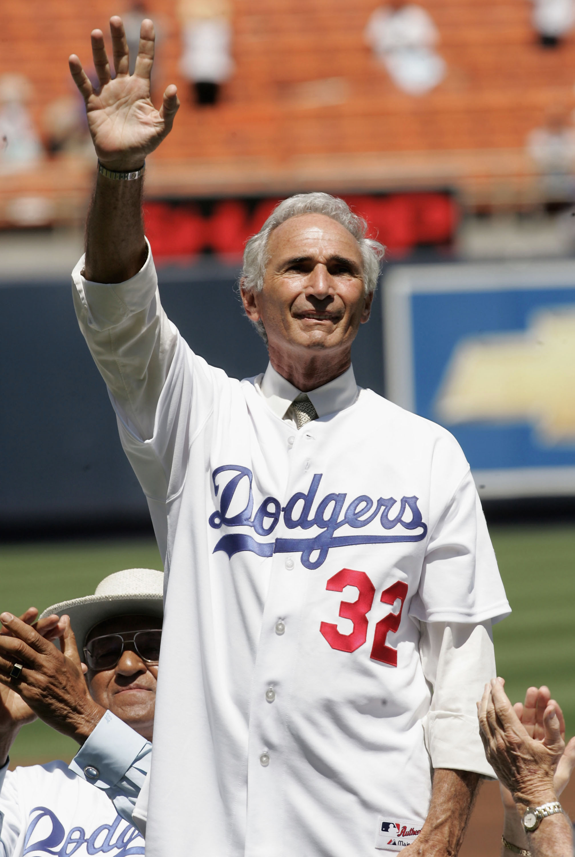 LOS ANGELES - AUGUST 28: Hall of Fame pitcher Sandy Koufax of the Los Angeles Dodgers waves to the crowd during ceremonies honoring memebers of the 1955 World Champion Dodgers before the game with the Houston Astros on August 28, 2005 at Dodger Stadium in