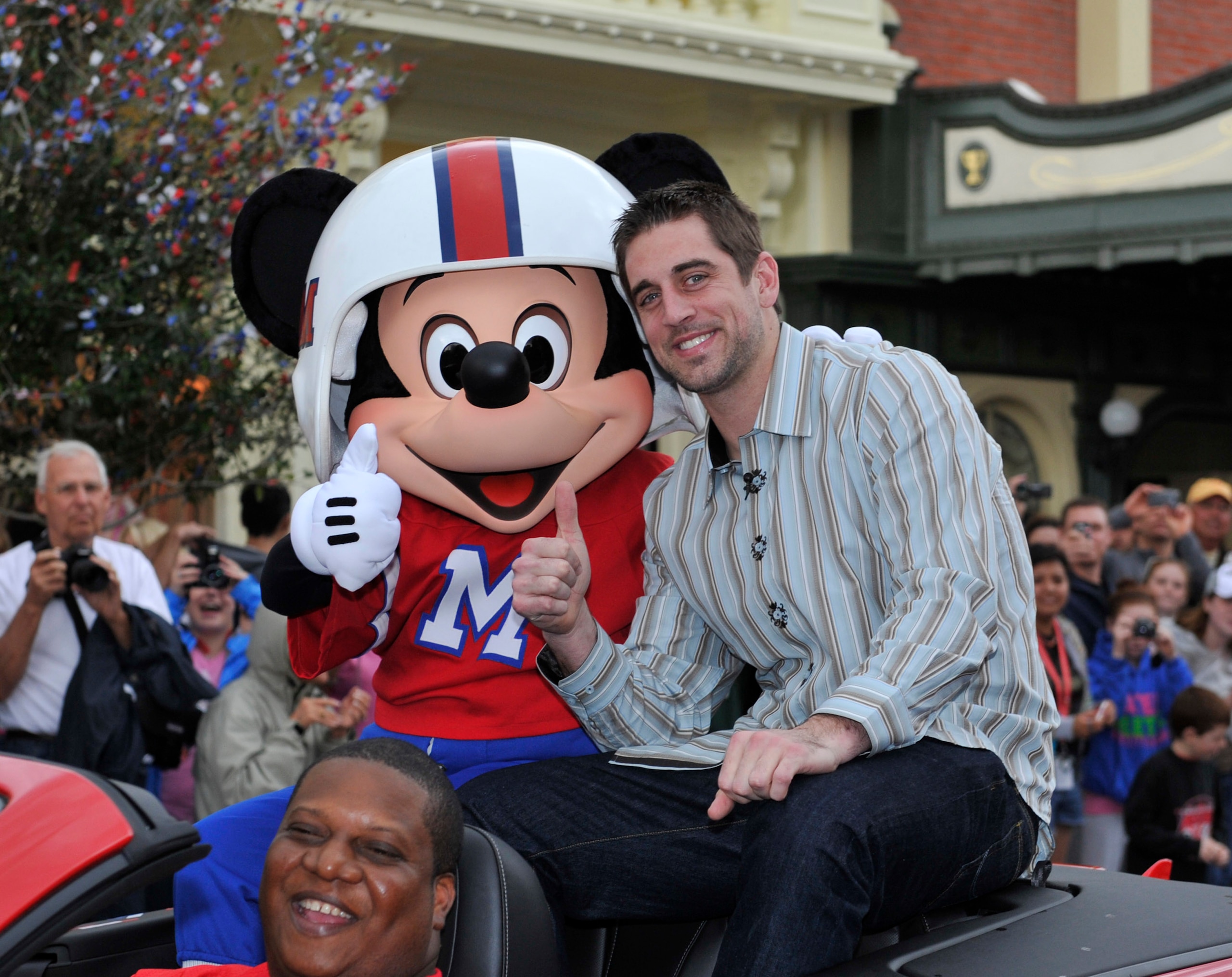 LAKE BUENA VISTA, FL - FEBRUARY 07:  In this handout photo provided by Disney, Super Bowl XLV Most Valuable Player Aaron Rodgers takes a celebratory ride with Mickey Mouse, following the Green Bay Packers' 31-25 victory over the Pittsburgh Steelers Februa