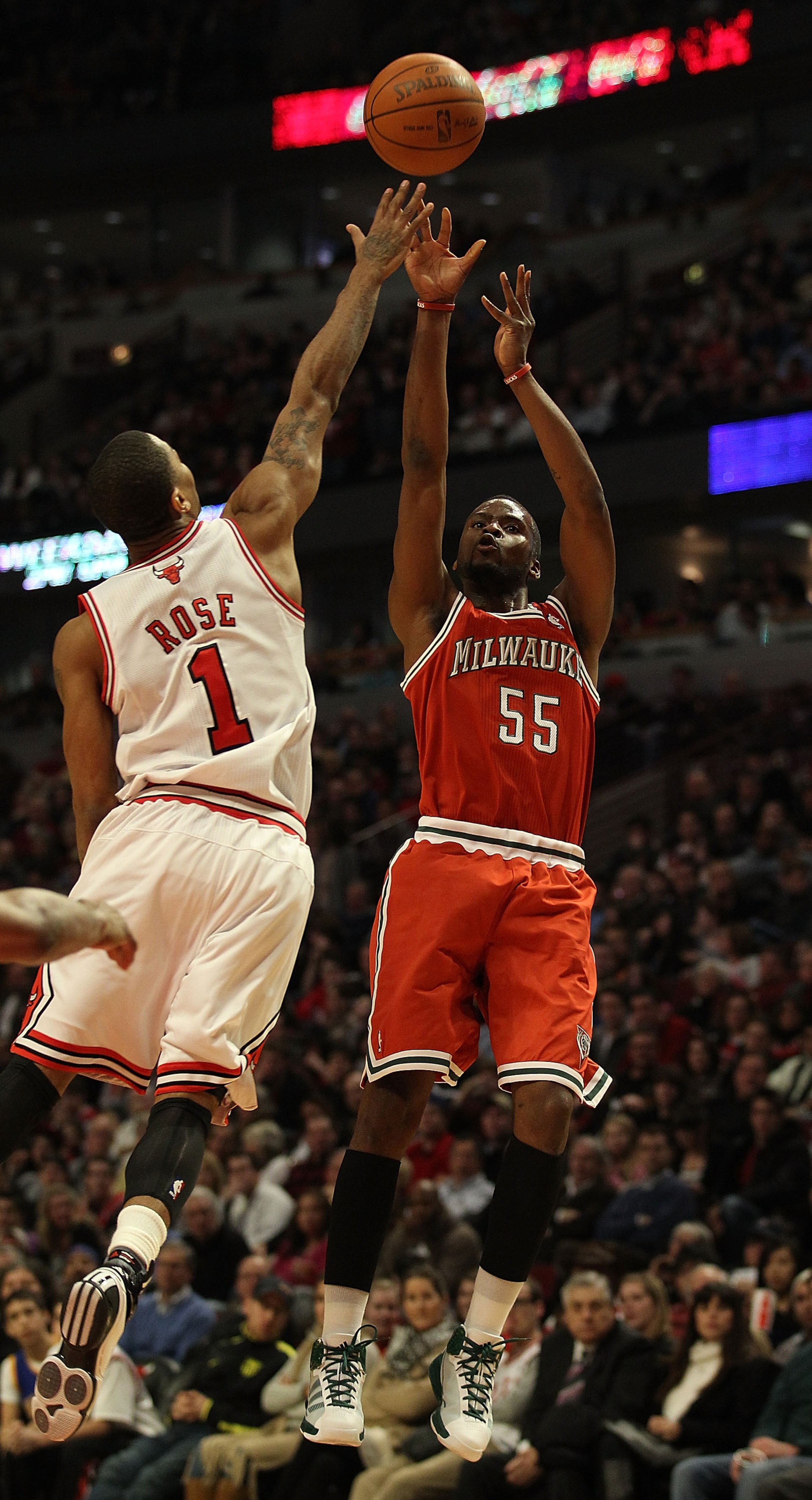 CHICAGO, IL - DECEMBER 28: Keyon Dooling #55 of the Milwaukee Bucks puts up a shot against Derrick Rose #1 of the Chicago Bulls at the United Center on December 28, 2010 in Chicago, Illinois. The Bulls defeated the Bucks 90-77. NOTE TO USER: User expressl CHICAGO, IL - DECEMBER 28: Keyon Dooling #55 of the Milwaukee Bucks puts up a shot against Derrick Rose #1 of the Chicago Bulls at the United Center on December 28, 2010 in Chicago, Illinois. The Bulls defeated the Bucks 90-77. NOTE TO USER: User expressl