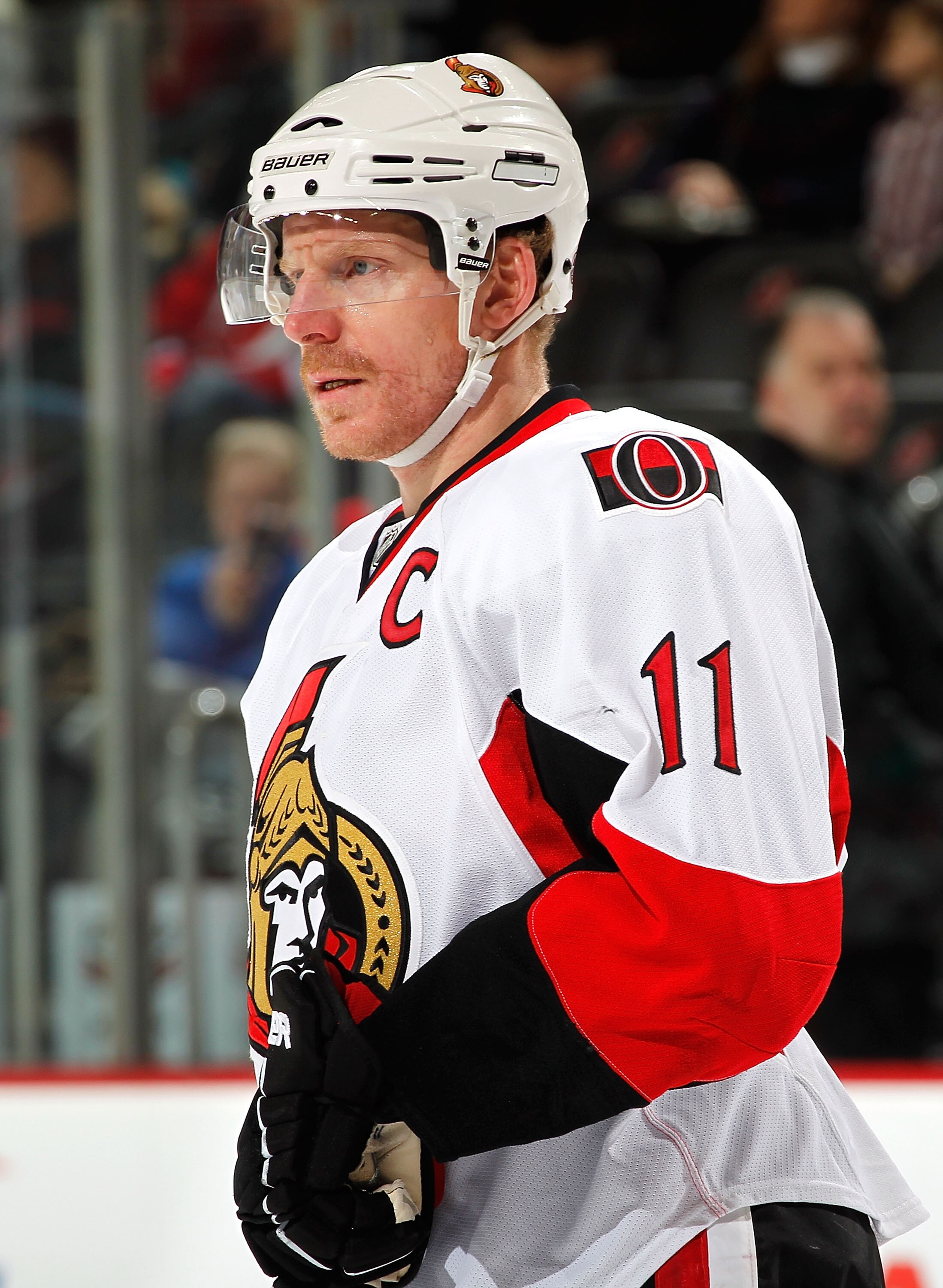 NEWARK, NJ - FEBRUARY 01:  Daniel Alfredsson #11 of the Ottawa Senators waits for a faceoff in an NHL hockey game against the New Jersey Devils at the Prudential Center on February 1, 2011 in Newark, New Jersey.  (Photo by Paul Bereswill/Getty Images)