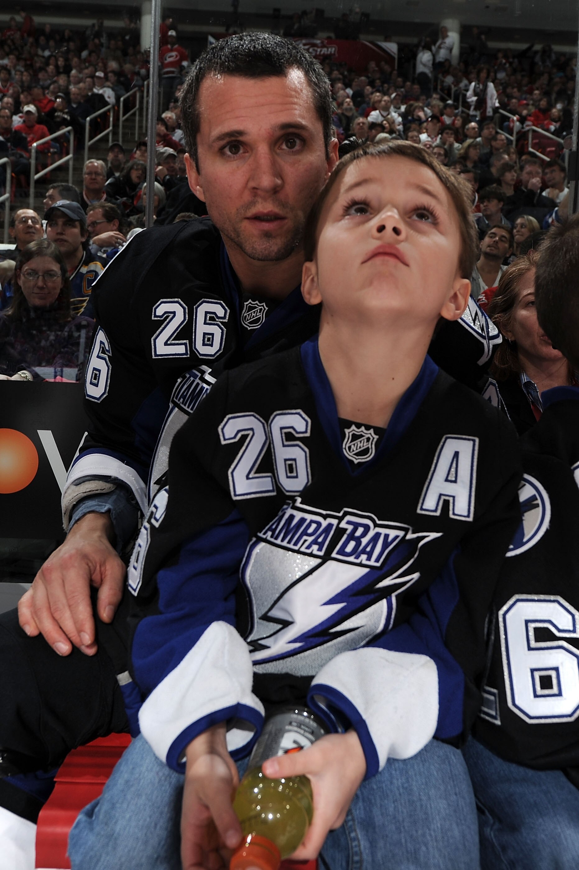 RALEIGH, NC - JANUARY 29:  Martin St. Louis #26 of the Tampa Bay Lightning with one of his sons during the Honda NHL SuperSkills competition part of 2011 NHL All-Star Weekend at the RBC Center on January 29, 2011 in Raleigh, North Carolina.  (Photo by Har