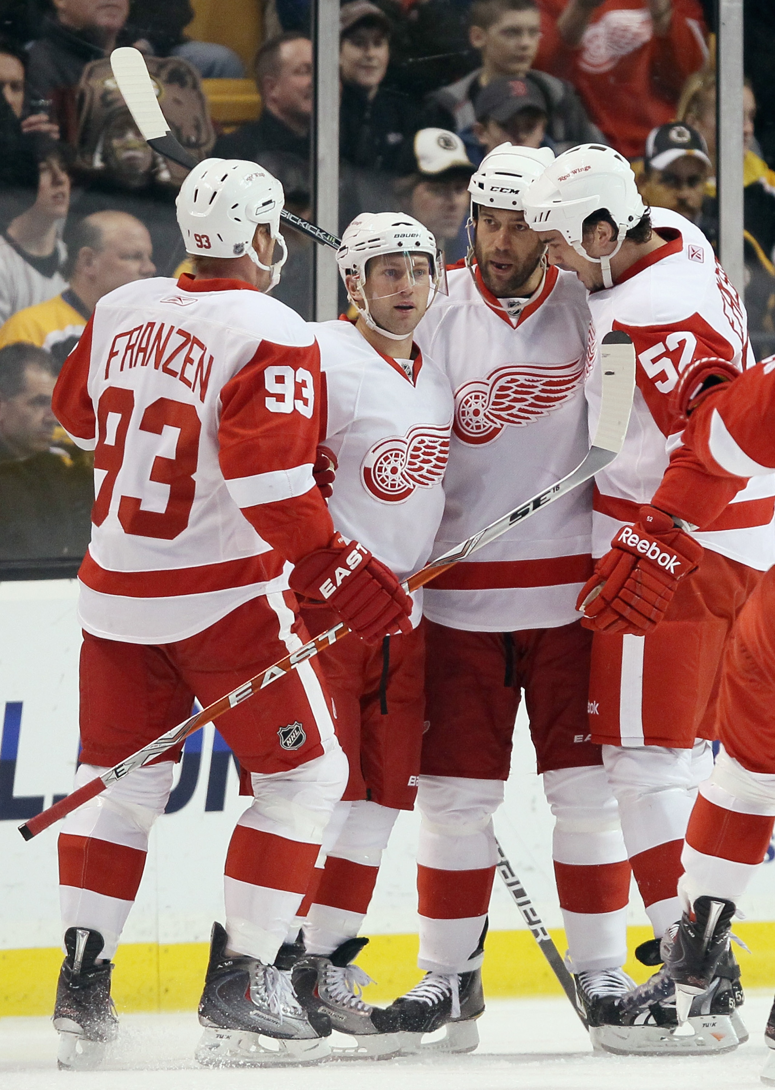 BOSTON, MA - FEBRUARY 11:  Todd Bertuzzi #44 of the Detroit Red Wings is congratulated by teammates Brian Rafalski #28,Johan Franzen #93 and Jonathan Ericsson #52 after Bertuzzi scored in the first period against the Boston Bruins on February 11, 2011 at