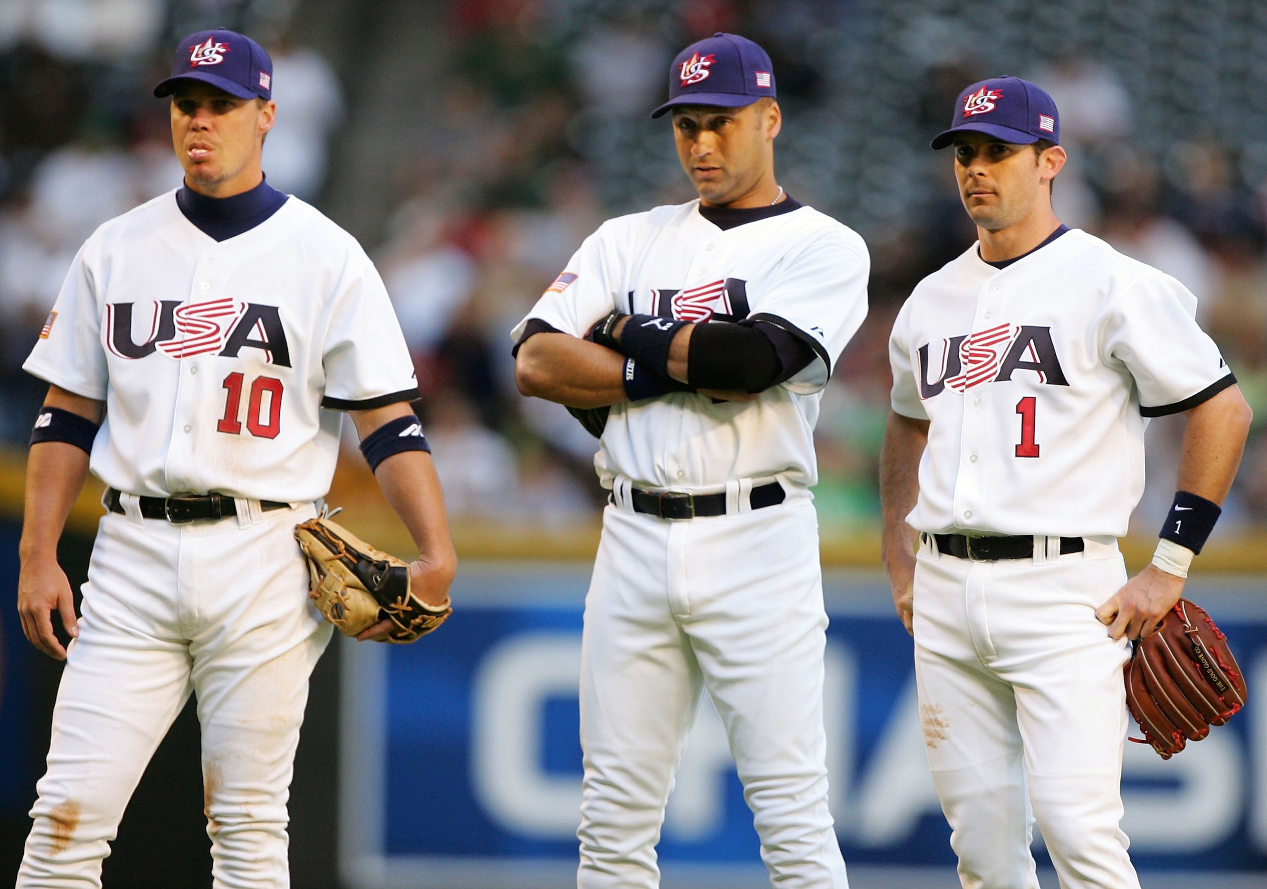PHOENIX - MARCH 08: Infielders Chipper Jones #10, Derrek Jeter #2 and Michael Young #1 of Team USA look on during a pitching change from the Round 1 Pool B Game of the World Baseball Classic against Team Canada on March 8, 2006 at Chase Field in Phoenix, PHOENIX - MARCH 08: Infielders Chipper Jones #10, Derrek Jeter #2 and Michael Young #1 of Team USA look on during a pitching change from the Round 1 Pool B Game of the World Baseball Classic against Team Canada on March 8, 2006 at Chase Field in Phoenix,