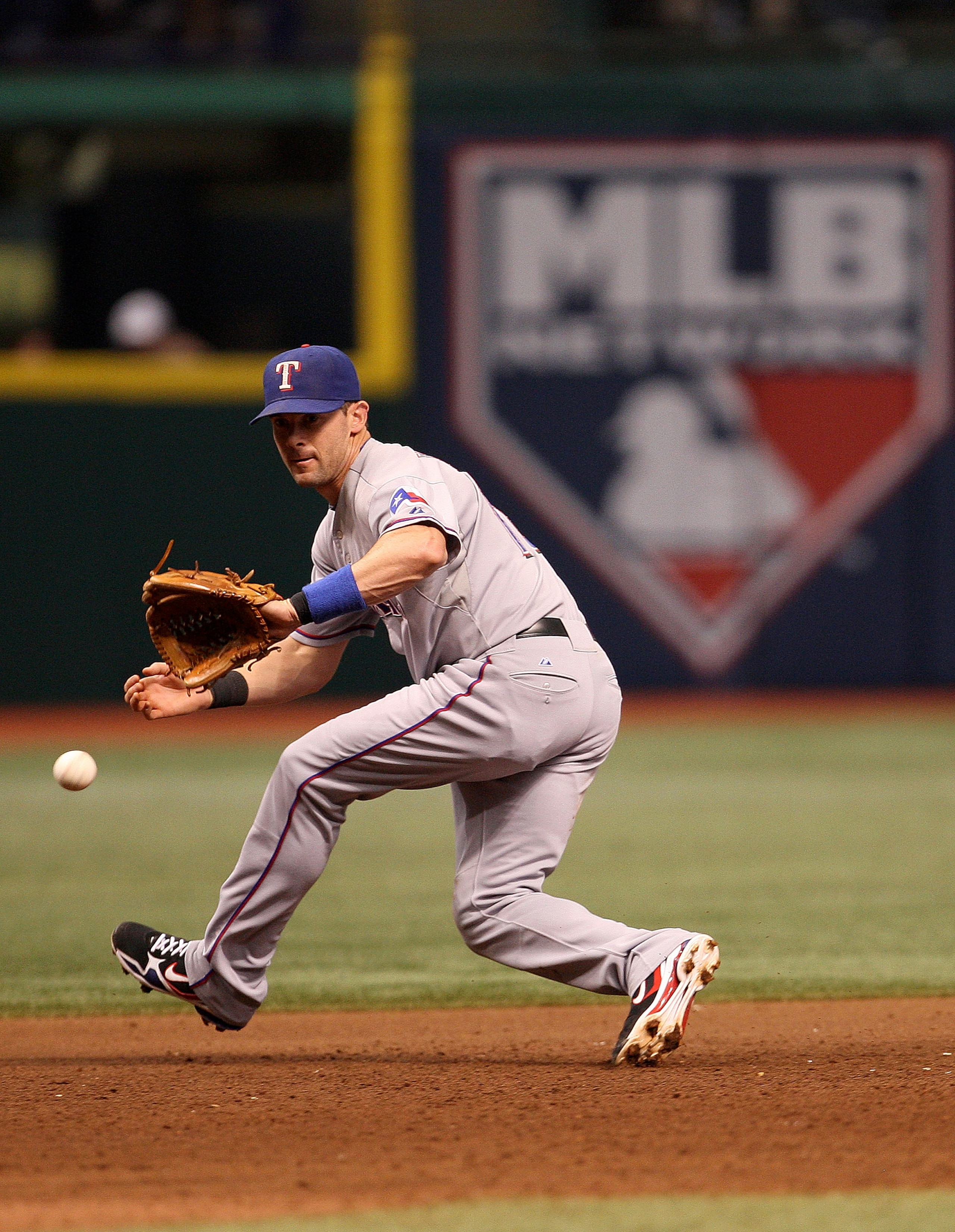 ST PETERSBURG, FL - OCTOBER 07: Michael Young #10 of the Texas Rangers fields a ground ball during Game 2 of the ALDS against the Tampa Bay Rays at Tropicana Field on October 7, 2010 in St. Petersburg, Florida. (Photo by Mike Ehrmann/Getty Images) ST PETERSBURG, FL - OCTOBER 07: Michael Young #10 of the Texas Rangers fields a ground ball during Game 2 of the ALDS against the Tampa Bay Rays at Tropicana Field on October 7, 2010 in St. Petersburg, Florida. (Photo by Mike Ehrmann/Getty Images)