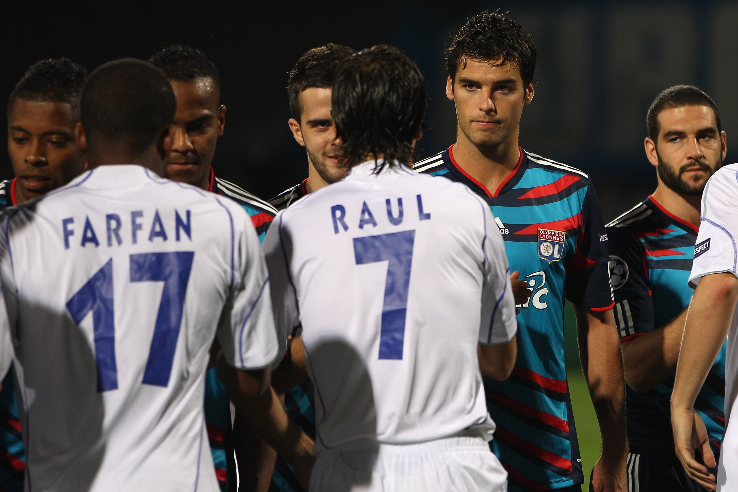 LYON, FRANCE - SEPTEMBER 14:  Yoann Gourcuff (2nd r) and Lisandro (r) of Lyon shake hands with Raul Gonzalez of Schalke before the UEFA Champions League Group B match between Olympique Lyonnais and FC Schalke 04 at the Stade de Gerland on September 14, 20