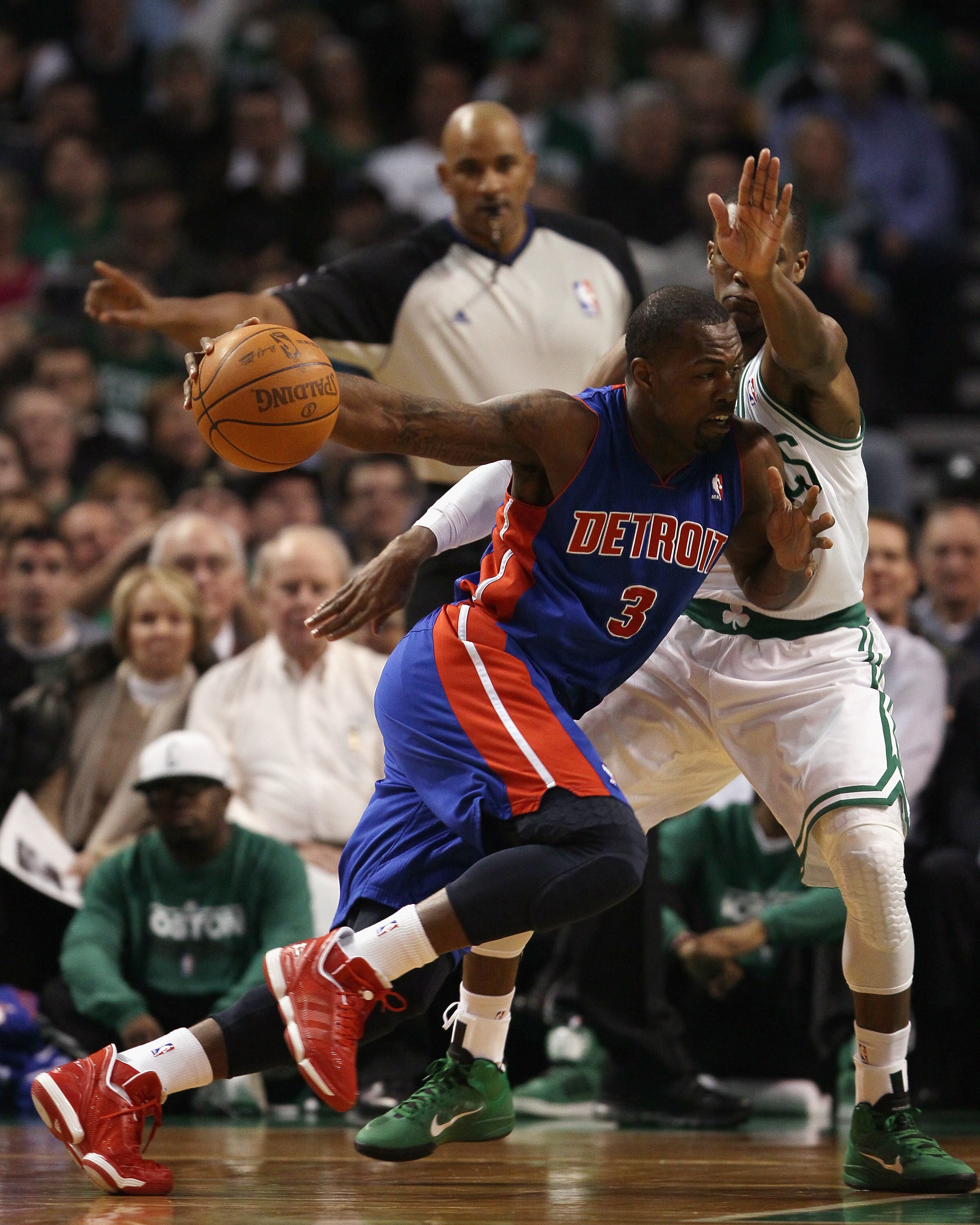 BOSTON, MA - JANUARY 19:  Rodney Stuckey #3 of the Detroit Pistons drives to the net as Rajon Rondo #9 of the Boston Celtics defends on January 19, 2011 at the TD Garden in Boston, Massachusetts.  NOTE TO USER: User expressly acknowledges and agrees that,