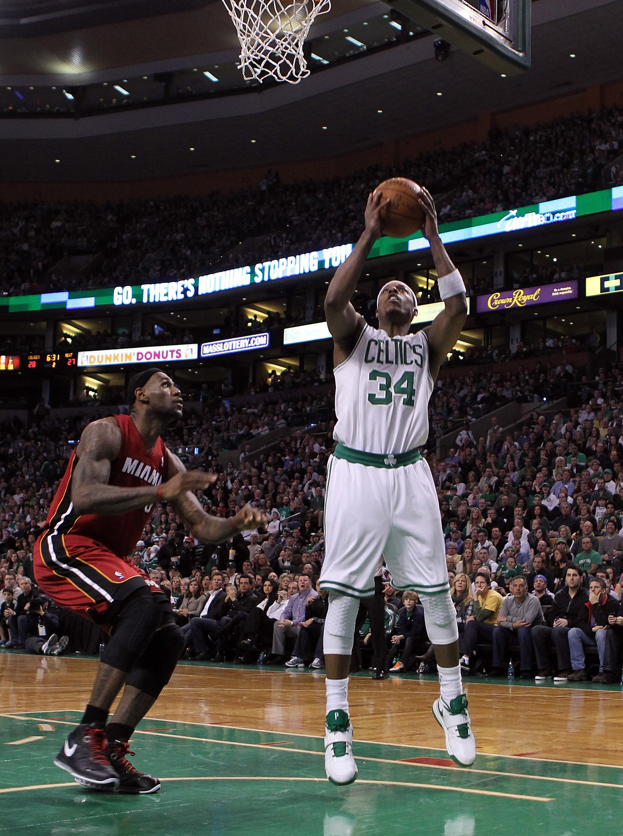 BOSTON - FEBRUARY 13:  LeBron James #6 of the Miami Heat defends as Paul Pierce #34 of the Boston Celtics shots a basket at TD Garden on February 13, 2011 in Boston, Massachusetts. NOTE TO USER: User expressly acknowledges and agrees that, by downloading